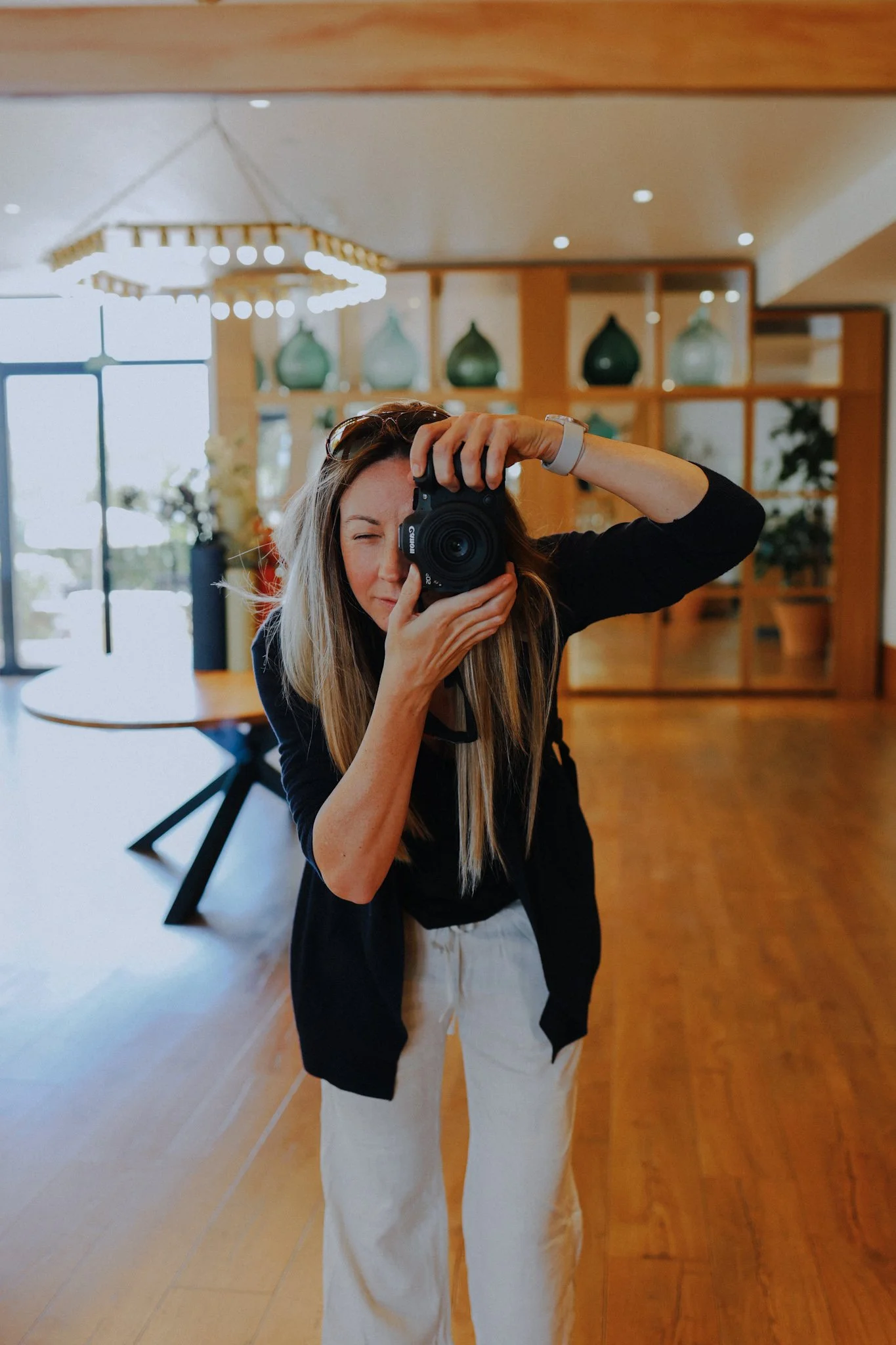 Lesley from Wander Scotland with camera in a small hotel
