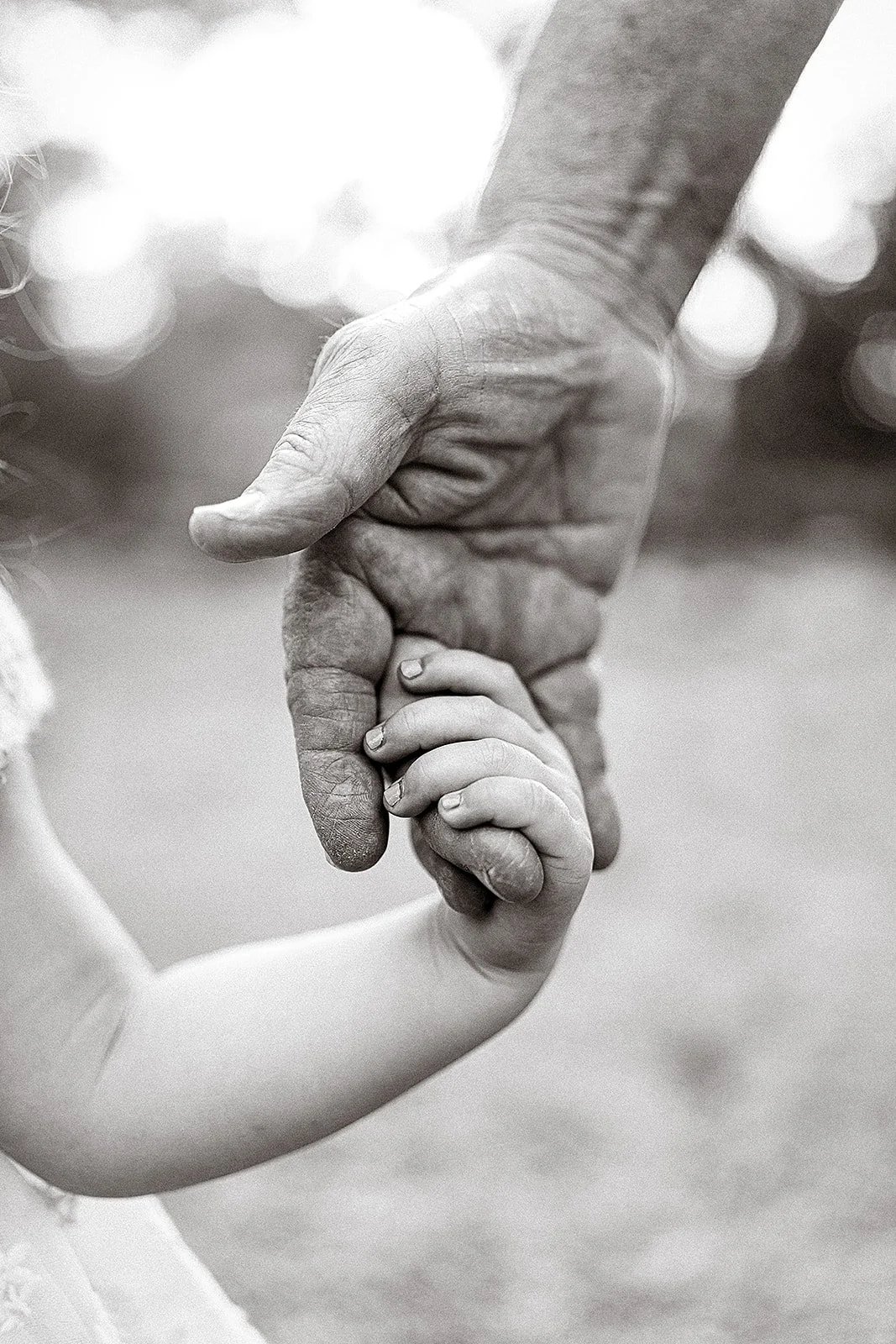 grandparent holding grandchild's hand