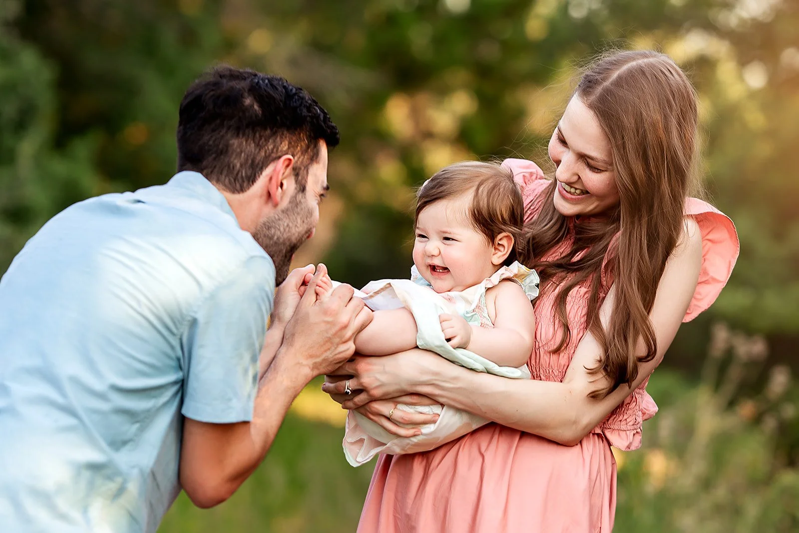 Dad kissing baby feet in family photos
