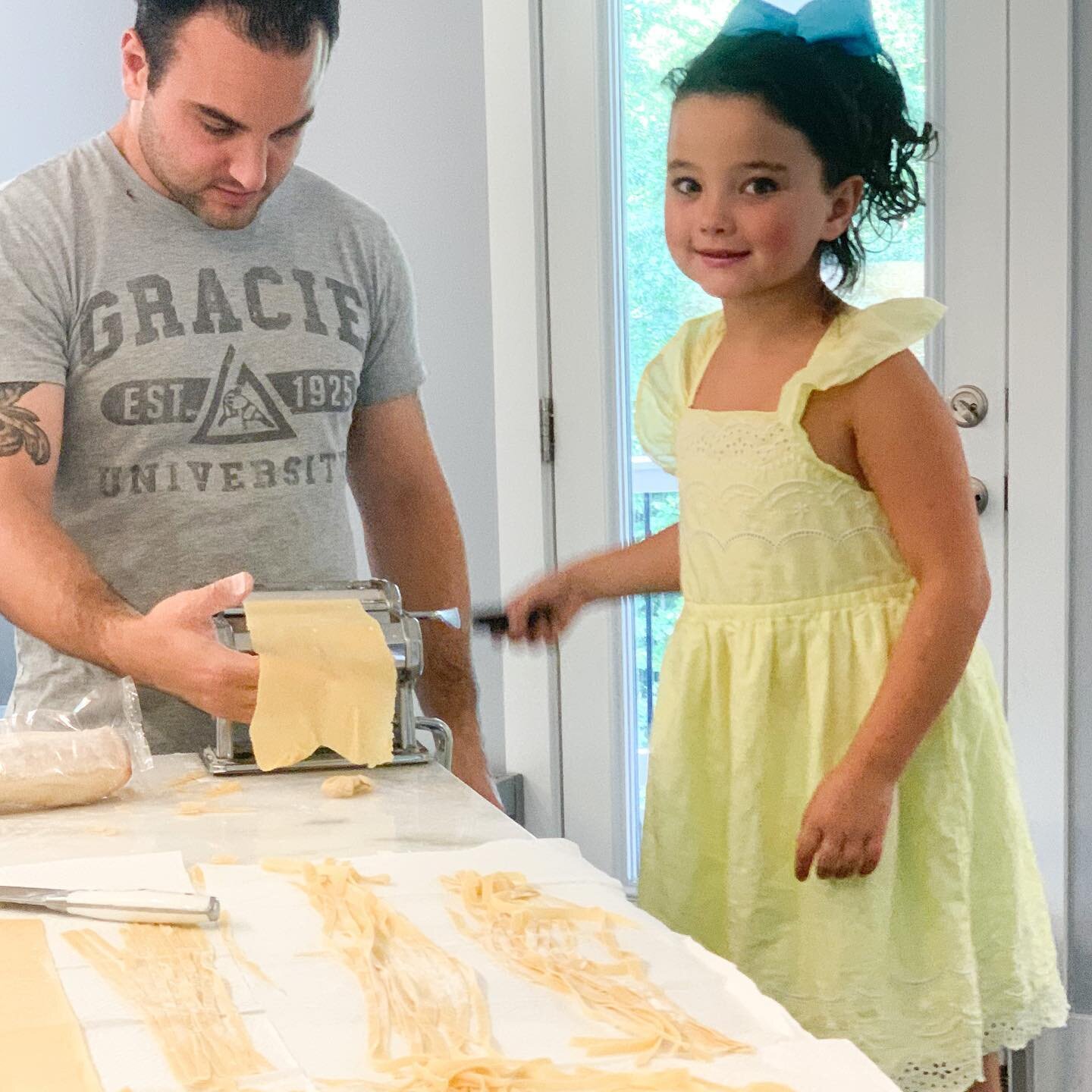 Father-daughter homemade pasta making ! And yes her name is Grace &quot;Gracie&quot; and yes that is my husbands favorite t-shirt that has her name ! With one daughter and three sons you could say she certainly has her little finger wrapped  around h