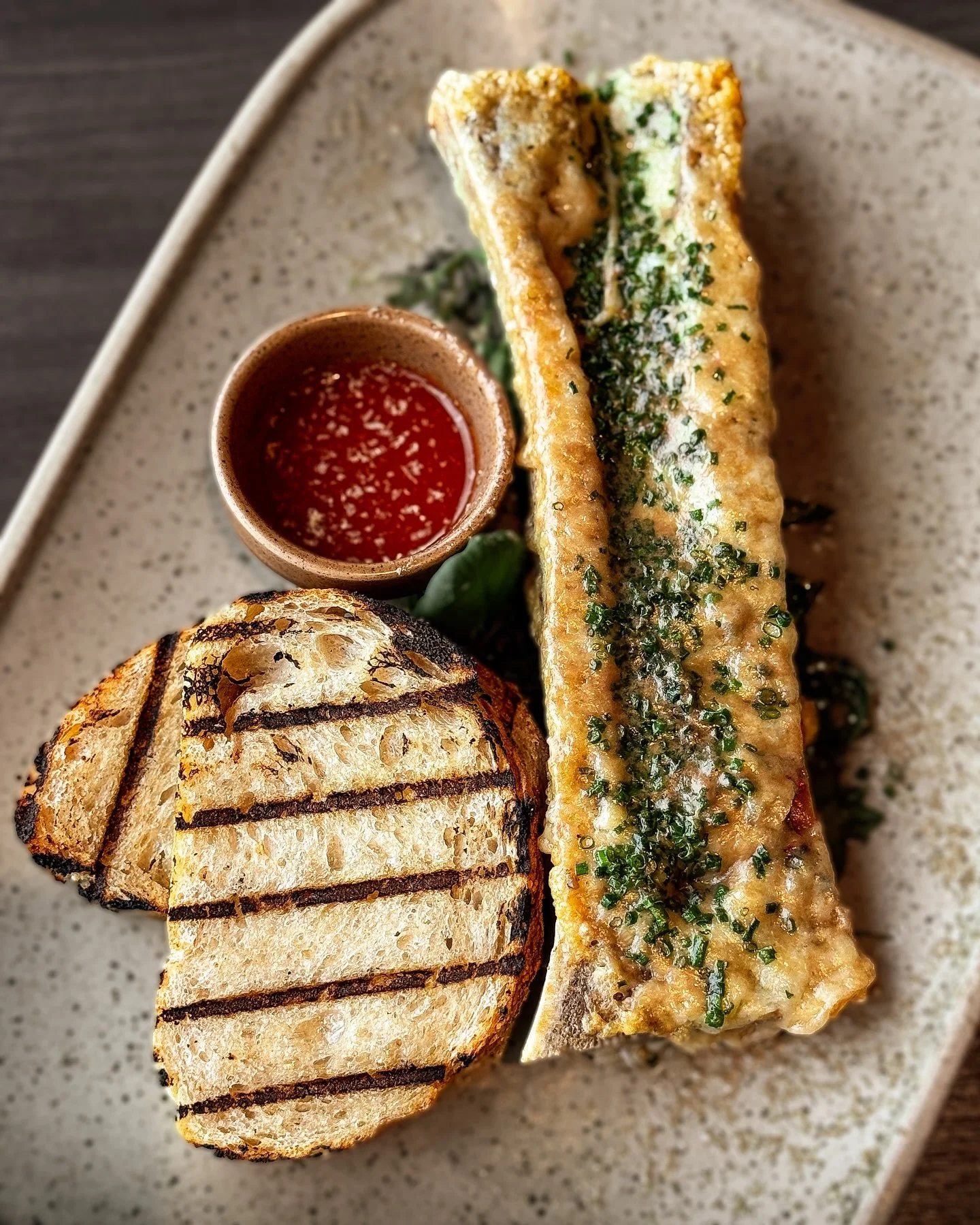 BONE MARROW ROCKEFELLER 
fresh shucked oyster, roasted bone marrow, gruy&egrave;re, chimichurri, sourdough crostini, foie gras snow, hot sauce 

Rich, unforgettable, and NEW to our Fall dinner menu. Dig in.