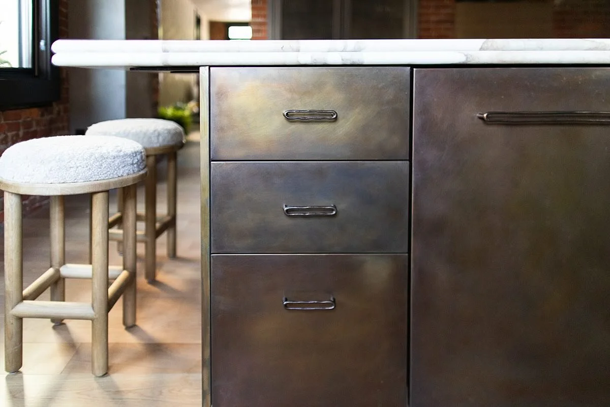 ✖️ a patinaed brass island with Calacatta Macchia Vecchia Italian marble.  A gorgeous pair that feels quite cozy in our brick-covered kitchen. Beautifully fabricated by @cooleycustomcabinetry and @modlichstoneworks #studioblackink #interiordesign #re