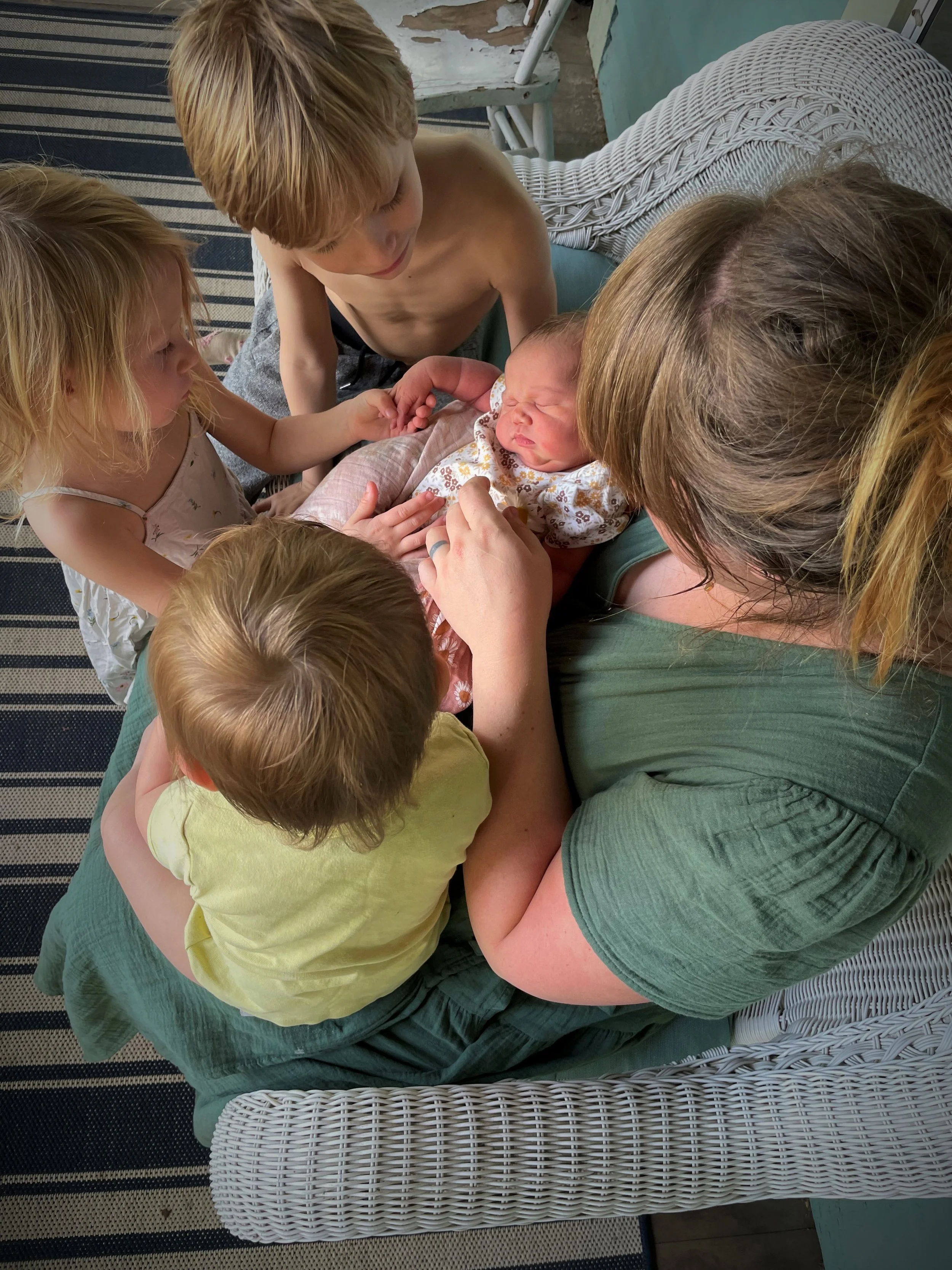 Newborn baby with family after birth doula support in Des Moines Iowa