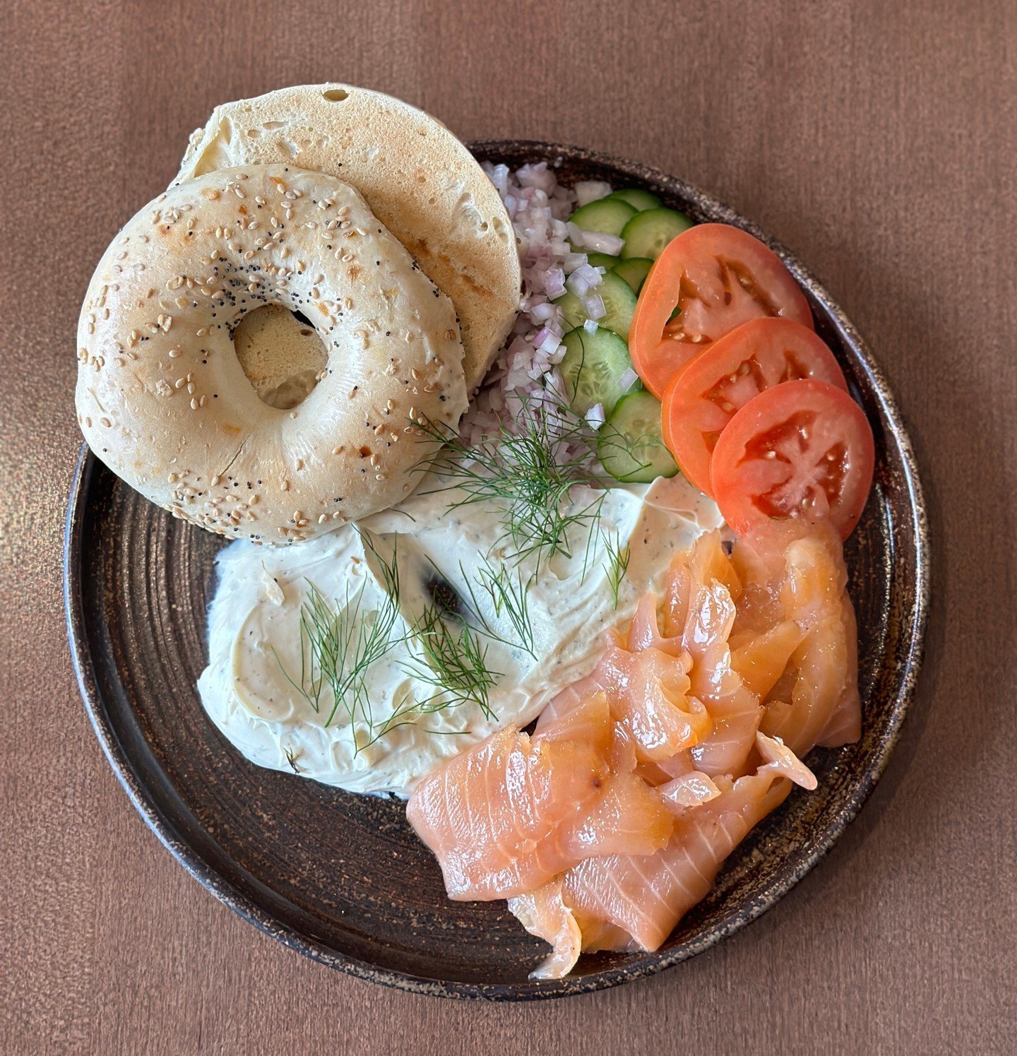Lox + Bagel, anyone?�

Dive into the exquisite flavors of house-cured salmon, delicately paired with fresh capers and creamy cream cheese, all nestled within a wholesome bagel.