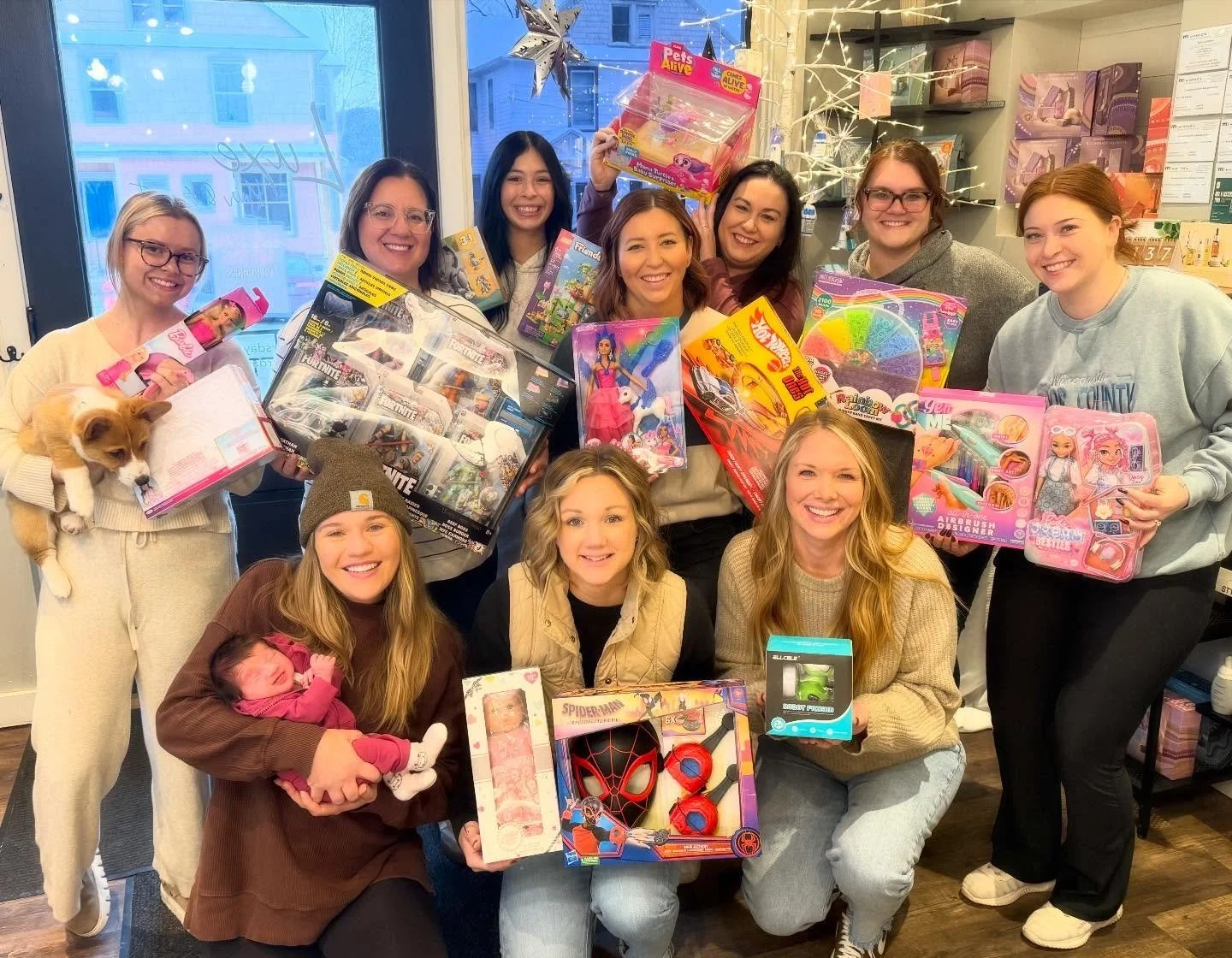 We had so much fun last year with this, we did it again! 
We are going on four years of supporting this wonderful, local program! 

For our employee secret santa drawing, the Luxe crew bought a child gift that they thought the person would of liked w