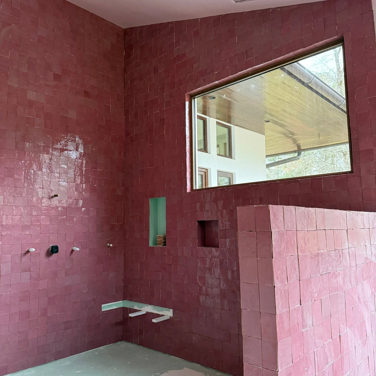 I rarely post work in progress, but my jaw dropped when I went to check in on the tile install at our Buckhead renovation. Still to come are the pink onyx bench and niche, light pink zellige and reclaimed, white-washed oak floor, custom vanity, coppe