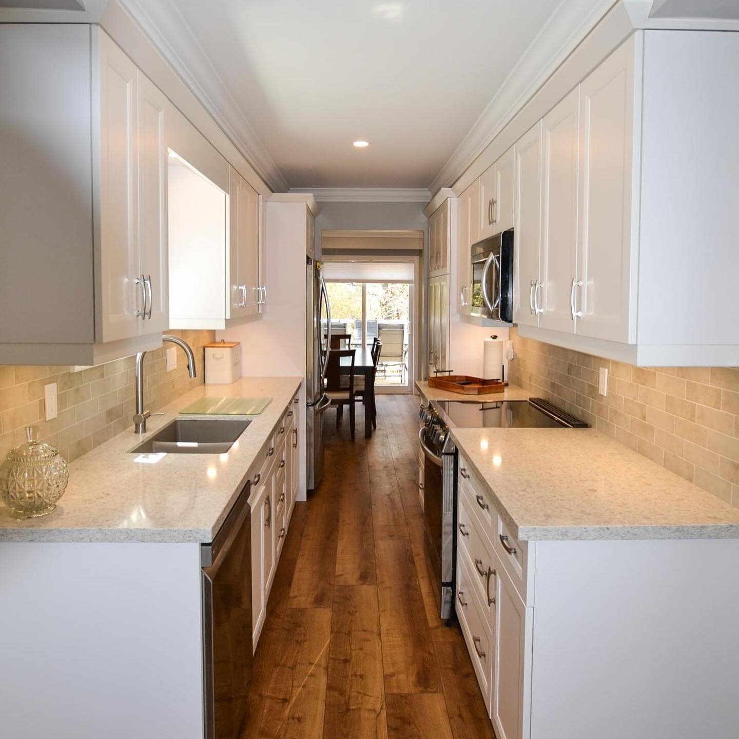 #BEFOREANDAFTER For this townhouse renovation we the PM Interiors Team took the galley kitchen and made it more functional with a better use of the space. A new staircase was created and a fireplace with a stone wall was made the focal point of this 