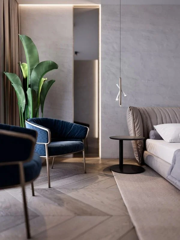 Al Ain Farm House · Al Ain — bedroom with blue armchair and timber floor