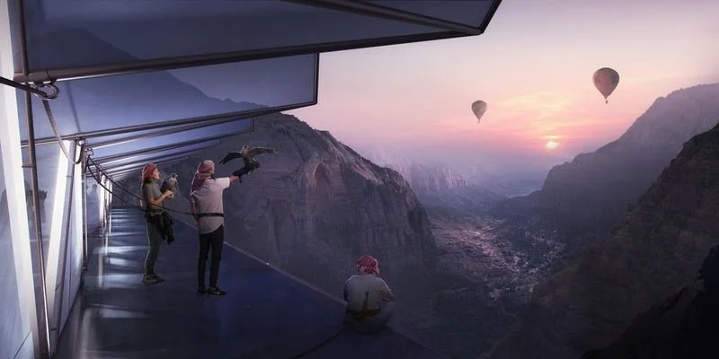 The Floating Retreat · Sharjah mountains — guests on a hanging balcony at dusk, hot-air balloons over the valley