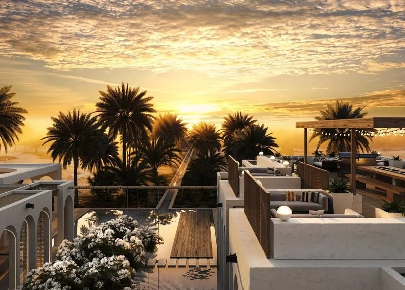 Al Ain Farm House · Al Ain — rooftop seating looking over palms at sunset