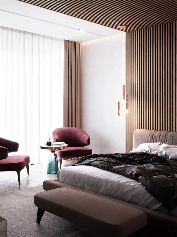 Al Ain Farm House · Al Ain — bedroom with timber panelling and armchairs