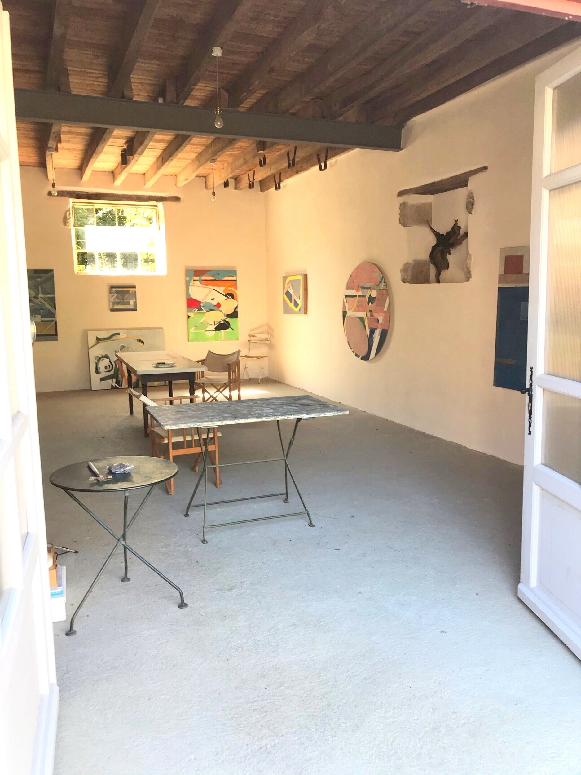 The studio with Ashley's paintings (the ceiling is now painted white).