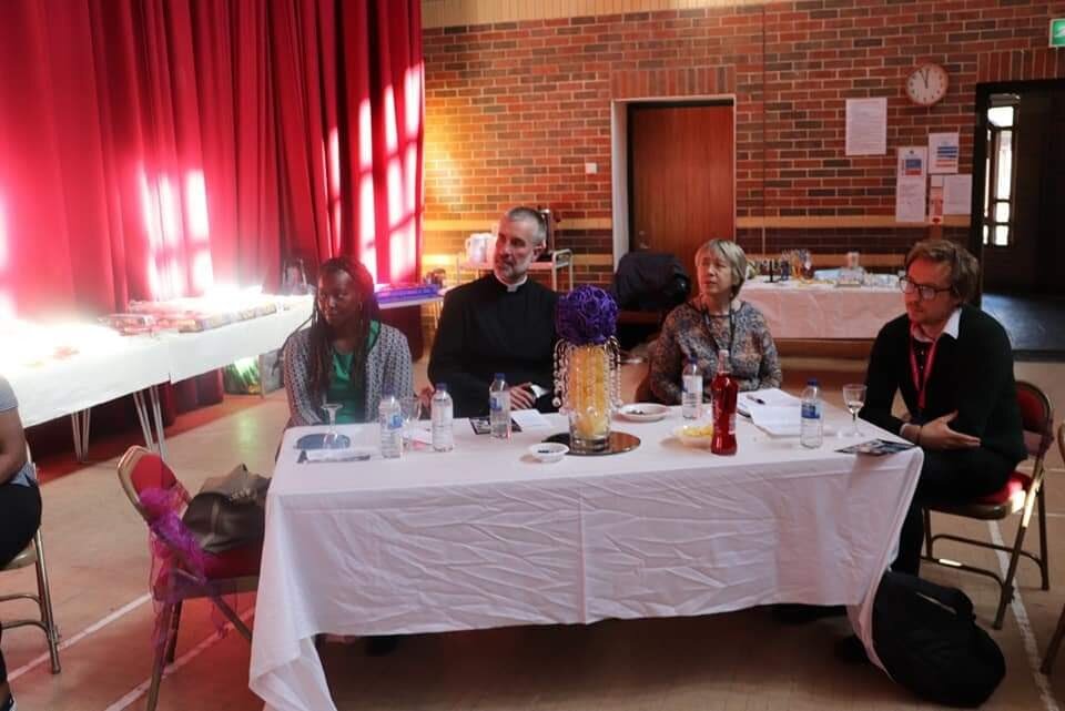 Rev. Father David of St Mary's Catholic Church at the Event. At the table is Cherished Supporter (Sarah Bull) on the right, next to her is (Harry Theaker), A representative from our funding body - The National Lottery Community.