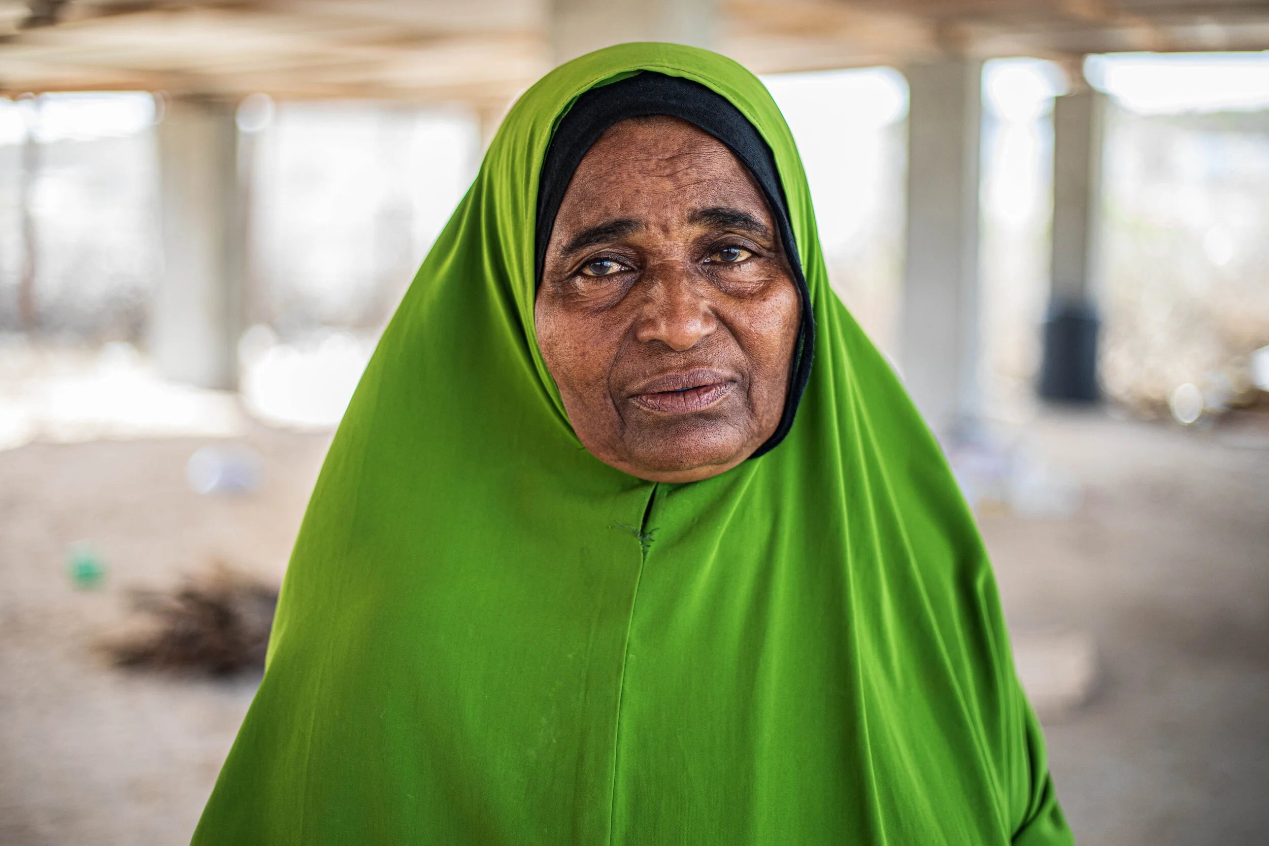 Close-up of an elderly woman wearing a bright green headscarf in Chovaye Island, Lower Juba region Somalia