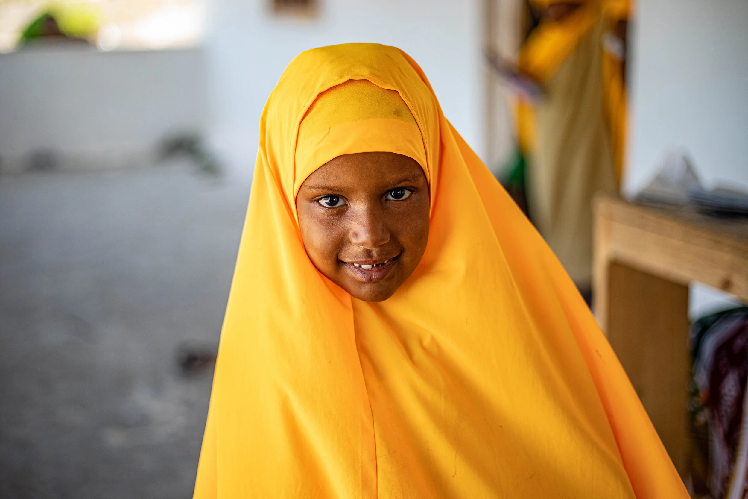 Samiya 7, a student at a school in Mudawa Island flashes a bright Smile in to the camera. 