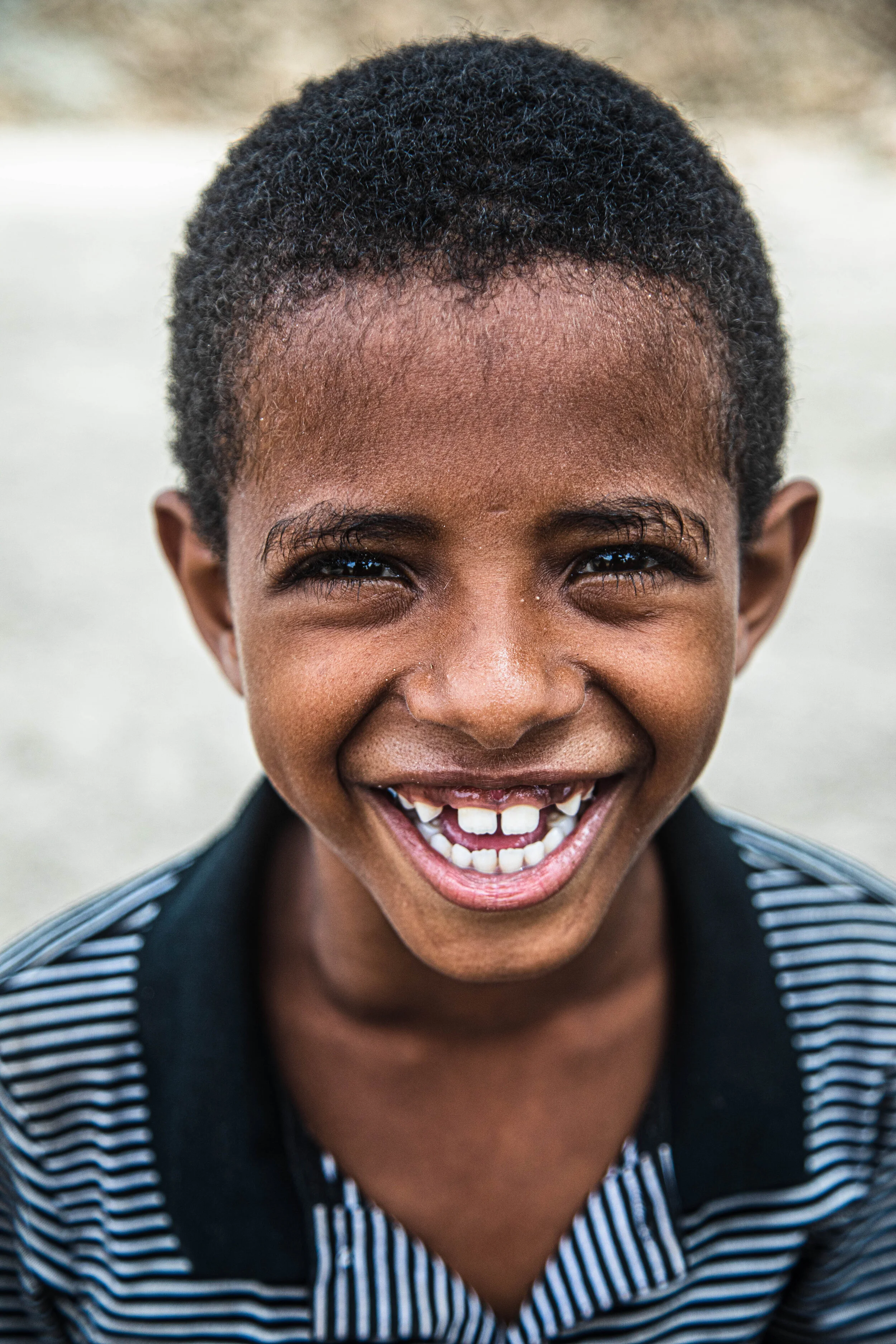 Close-up of a smiling young boy.