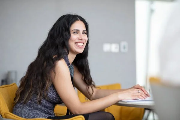 Young Trainee lawyer smiling in a business meeting