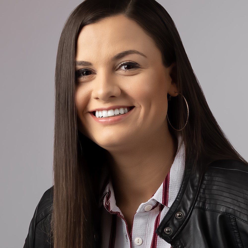 Don Evans Photography in Greensboro NC Professional Headshot of an actress with long hair wearing a striped white shirt and black leather jacket.jpg