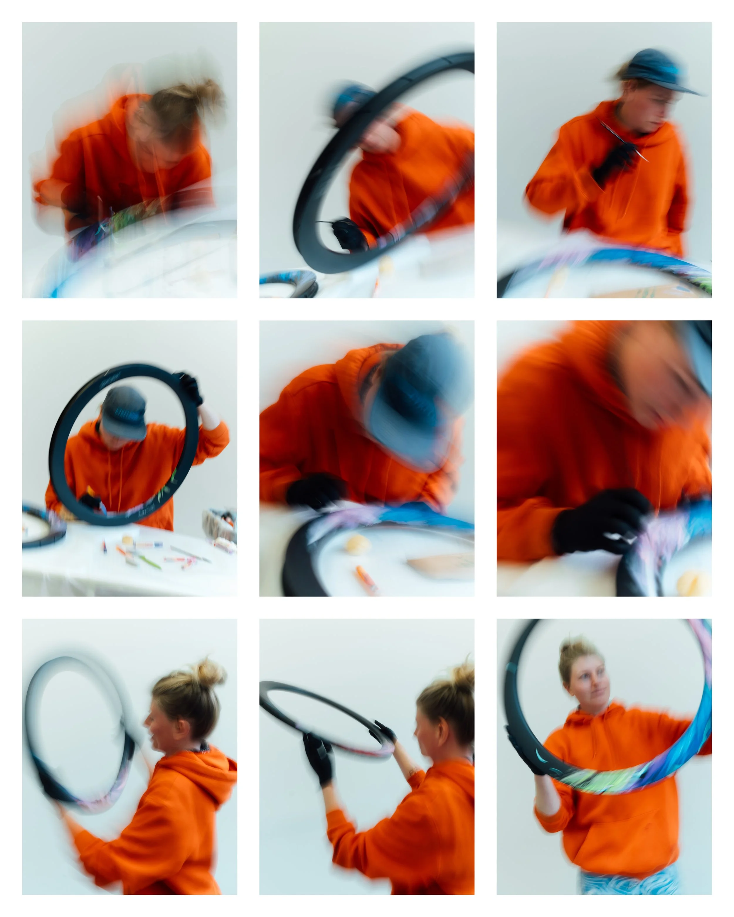 Person draws on a carbon wheel set. The pictures are blurred