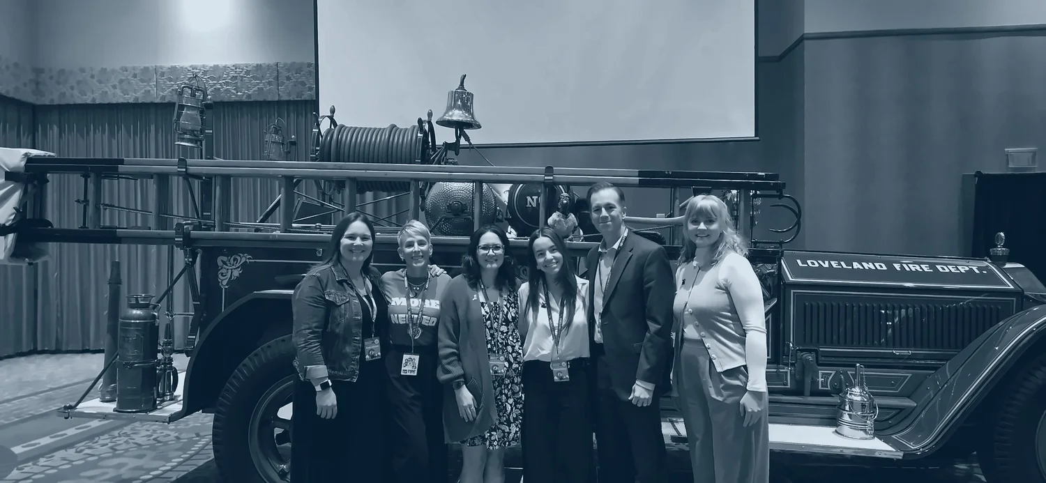 Science to the Station team in front of a restored Loveland Fire Dept. engine
