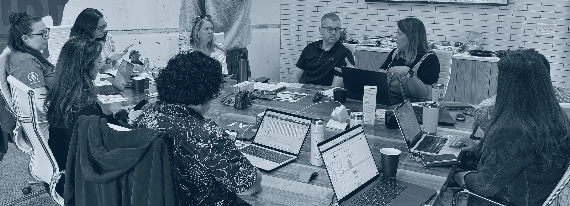 A Science to the Station workgroup meeting around a table