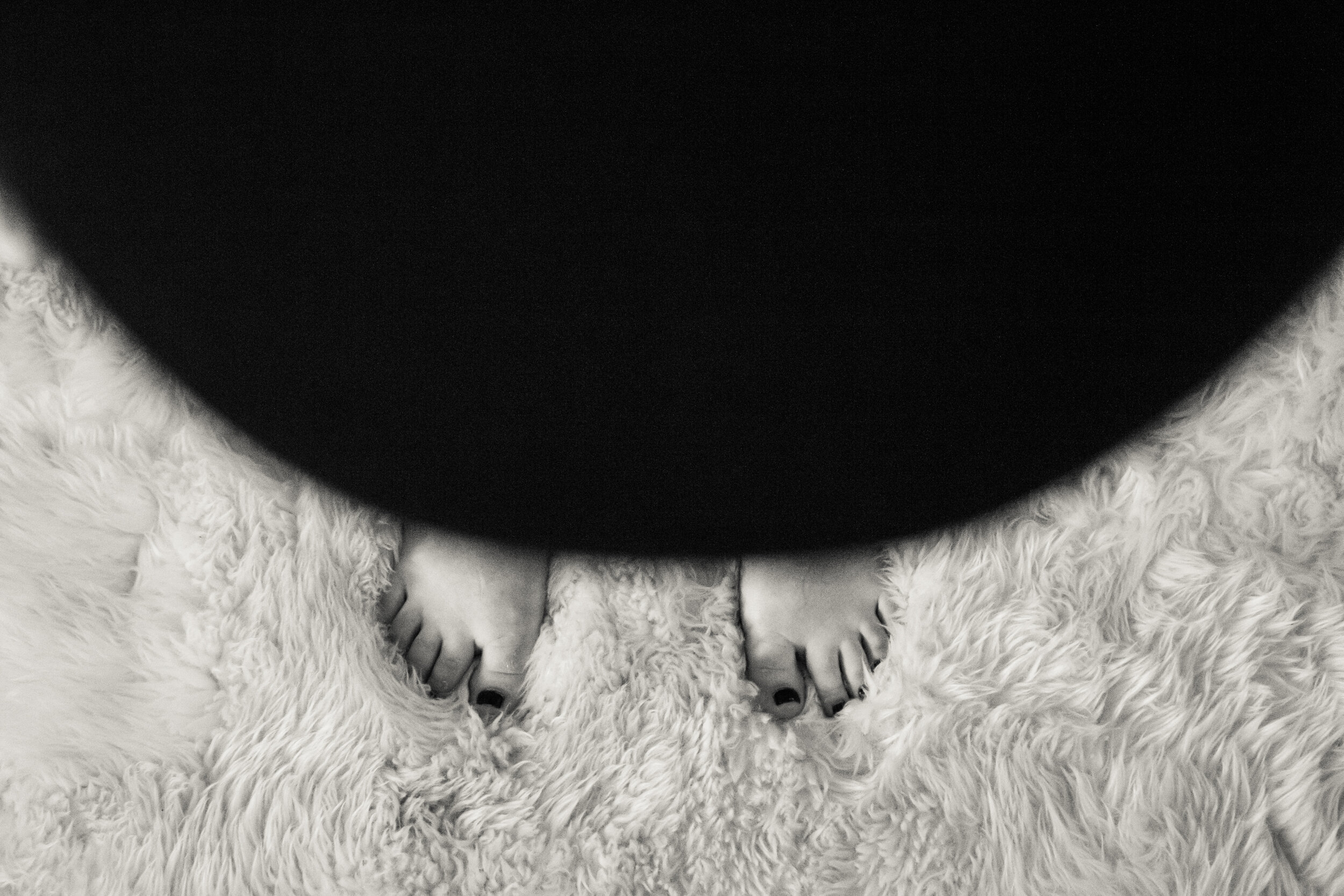 Rachel Vernon, 27, is in her third trimester of pregnancy. Here, she peers over her baby belly in attempt to see her toes. “I lost sight of my feet at about 7 months in,” Rachel laughed.