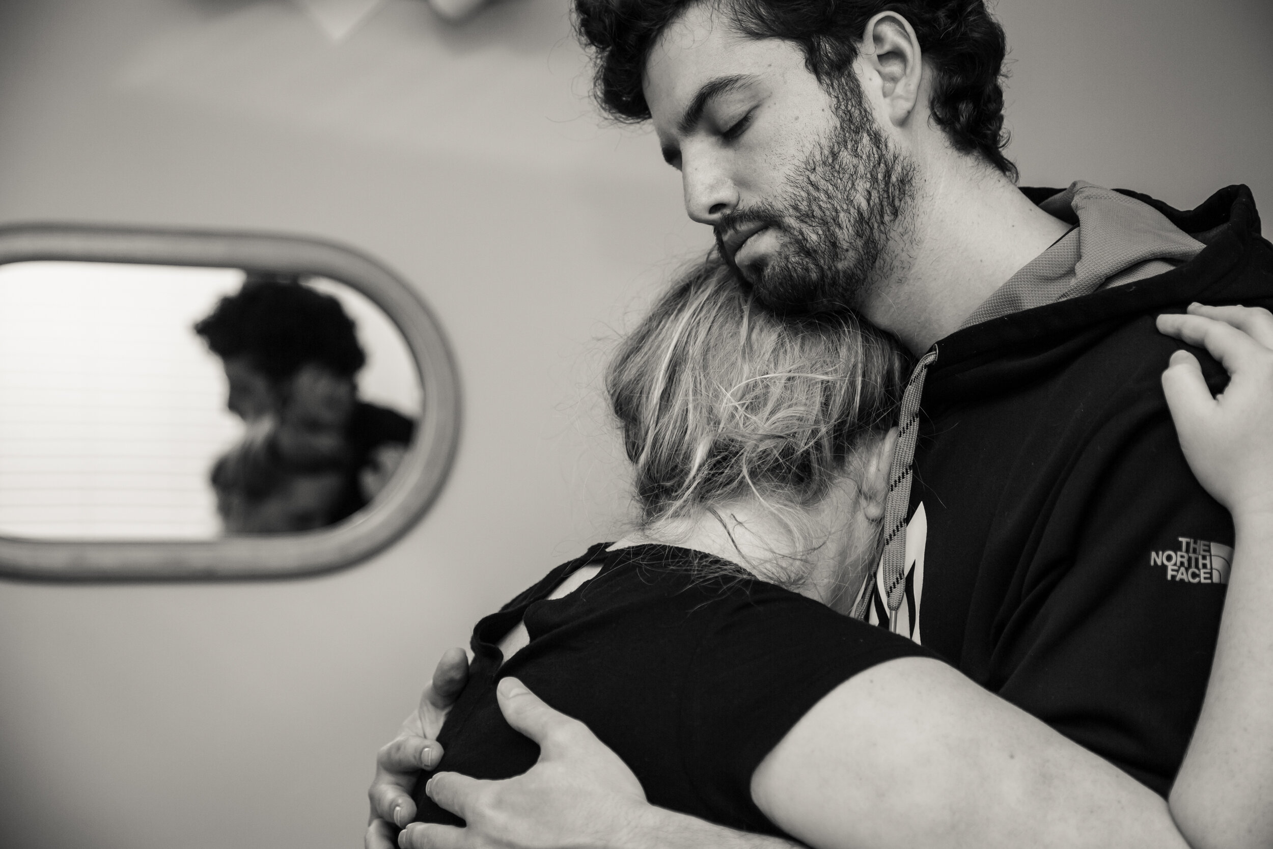 12 hours later, and Rachel is still experiencing contractions with very little progress on her dialation (4 cm). Here, Ryan comforts Rachel during her two minutes of rest before the next contraction.