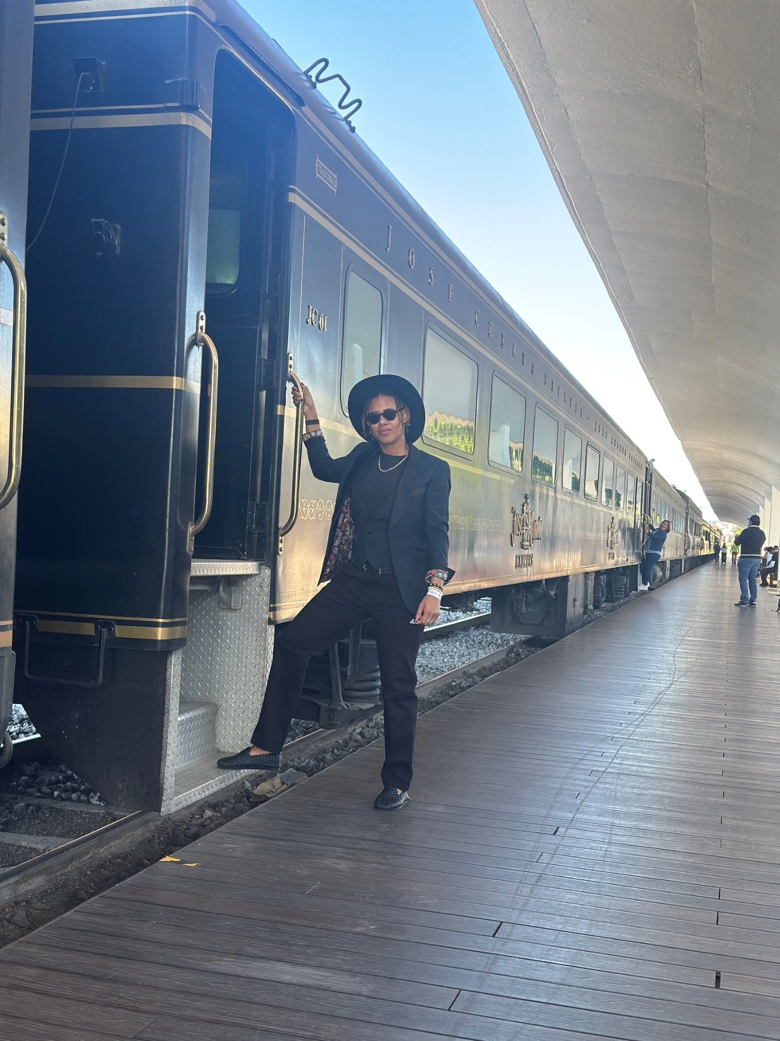 Ebony beside the José Cuervo Express train before traveling from Guadalajara to Tequila, Mexico.
