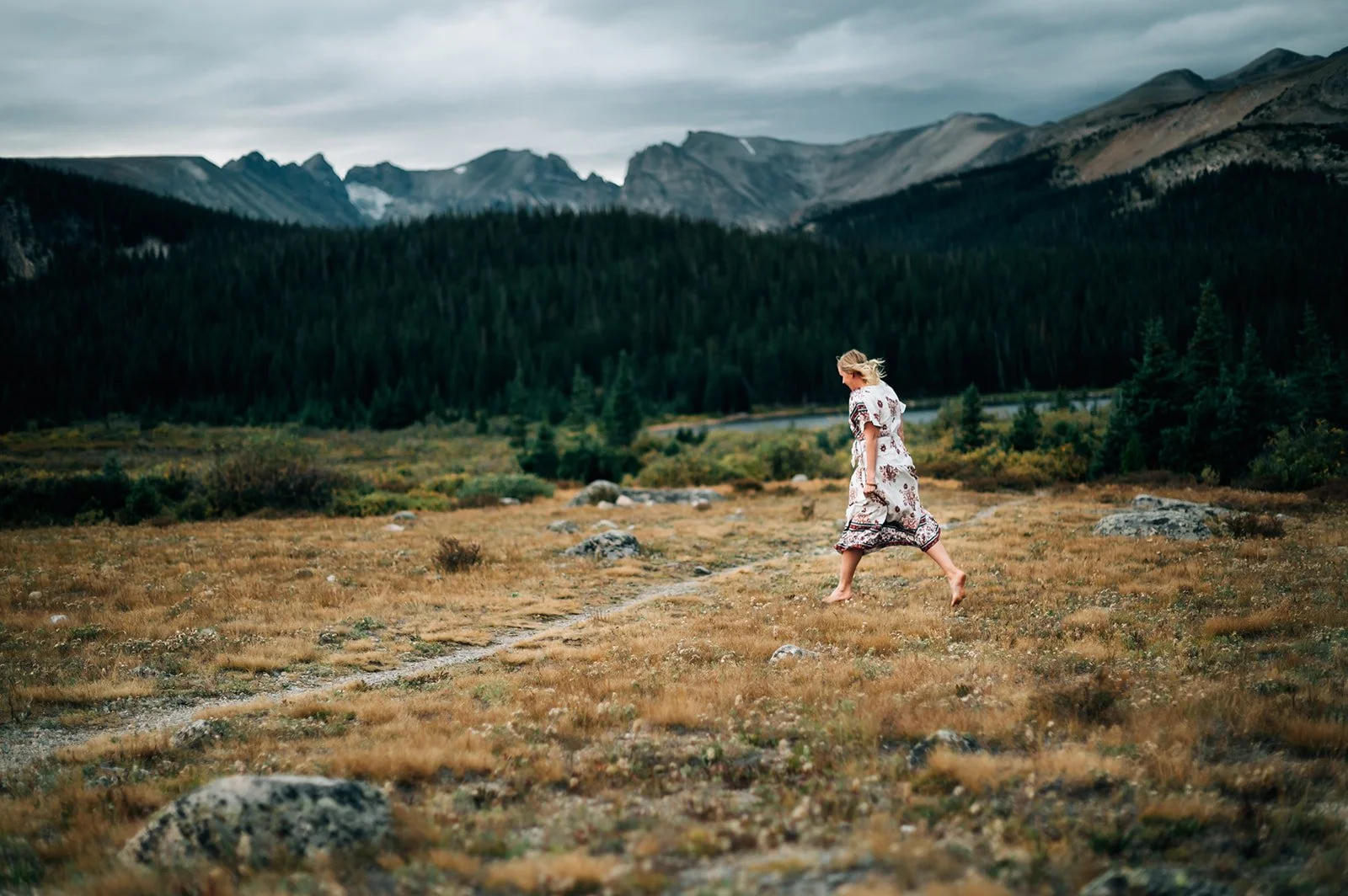 Julie Ciecior, the best female therapists for women in Boulder, CO. Photo of her walking near foothills of Boulder, CO.
