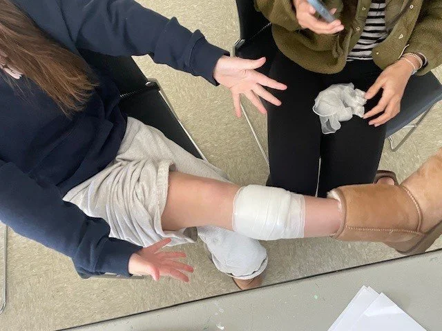 Teens and young students learning first aid and cpr for a babysitting certification