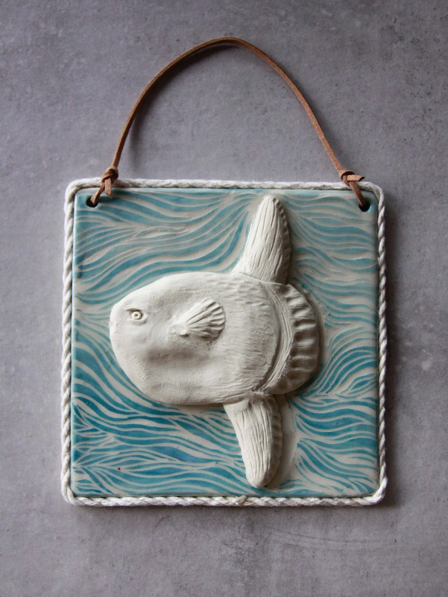 ✨&rdquo;Cracks &amp; Currents&rdquo;🌊

The odd yet fascinating Mola Mola (Sunfish) was a delight to explore through white stoneware clay. I left the clay unglazed to enhance the textures, while the waves were created through layers of underglaze and