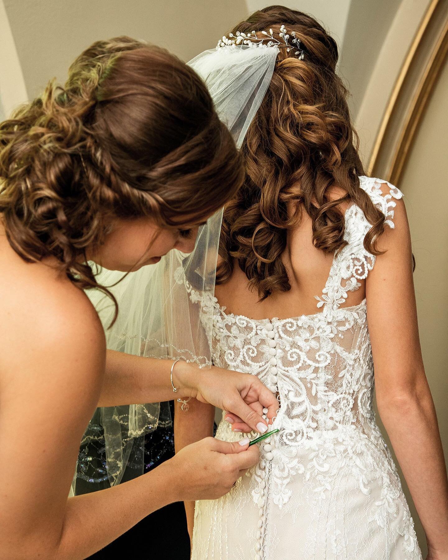The other day I posted about crochet hooks coming in handy for button wedding dresses. Here is one being used at Chelsea&rsquo;s wedding! If you want to save a lot of time I highly recommend picking one up at hobby lobby or Walmart before your big da
