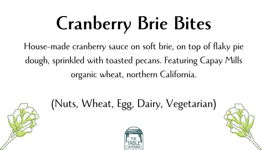 A menu for Cranberry Brie Bites with details about ingredients and features, along with two small illustrations of green and white flowers.