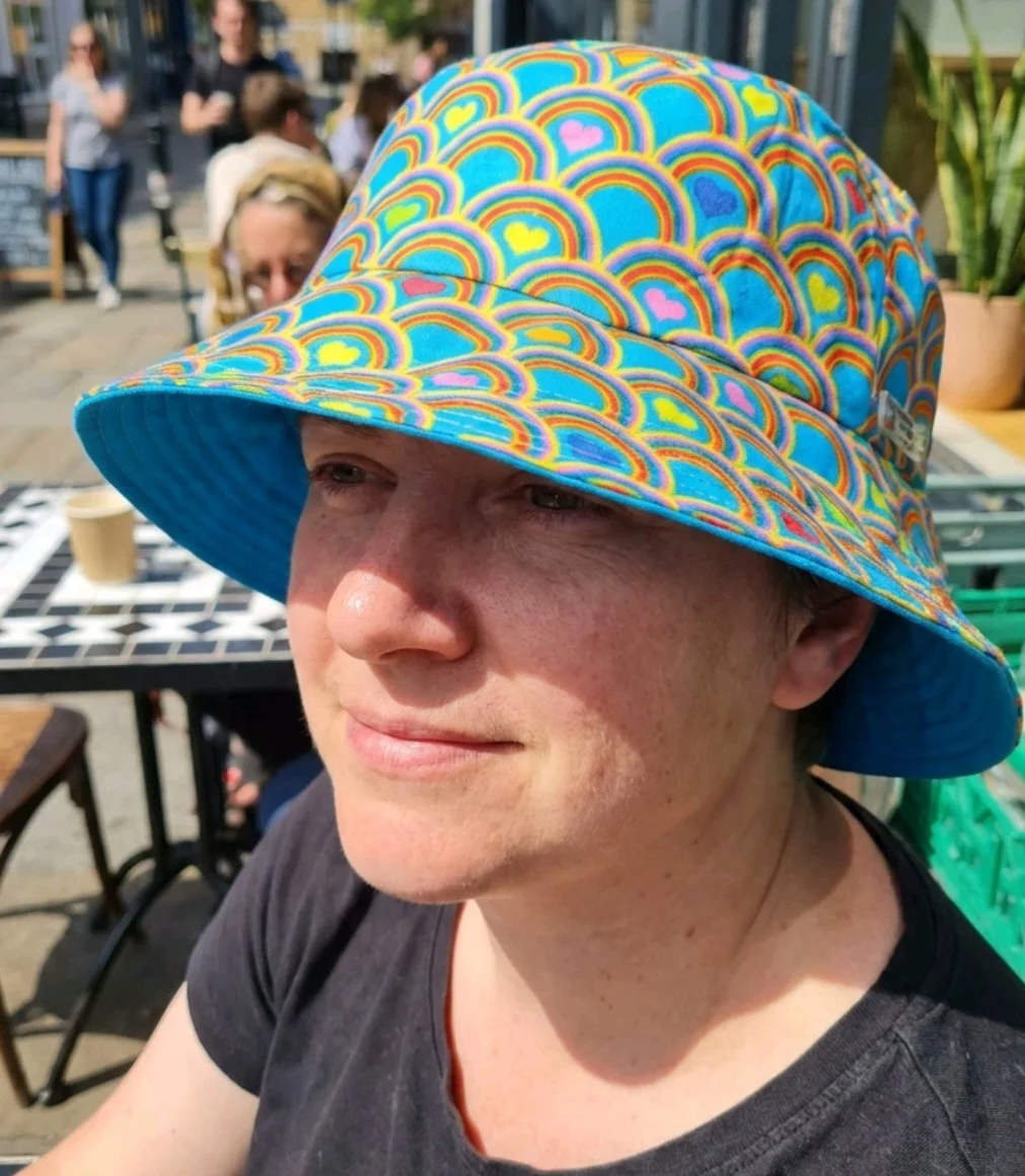 festival  summer   reversible bucket hat   inclusive fun  hat blue rainbows