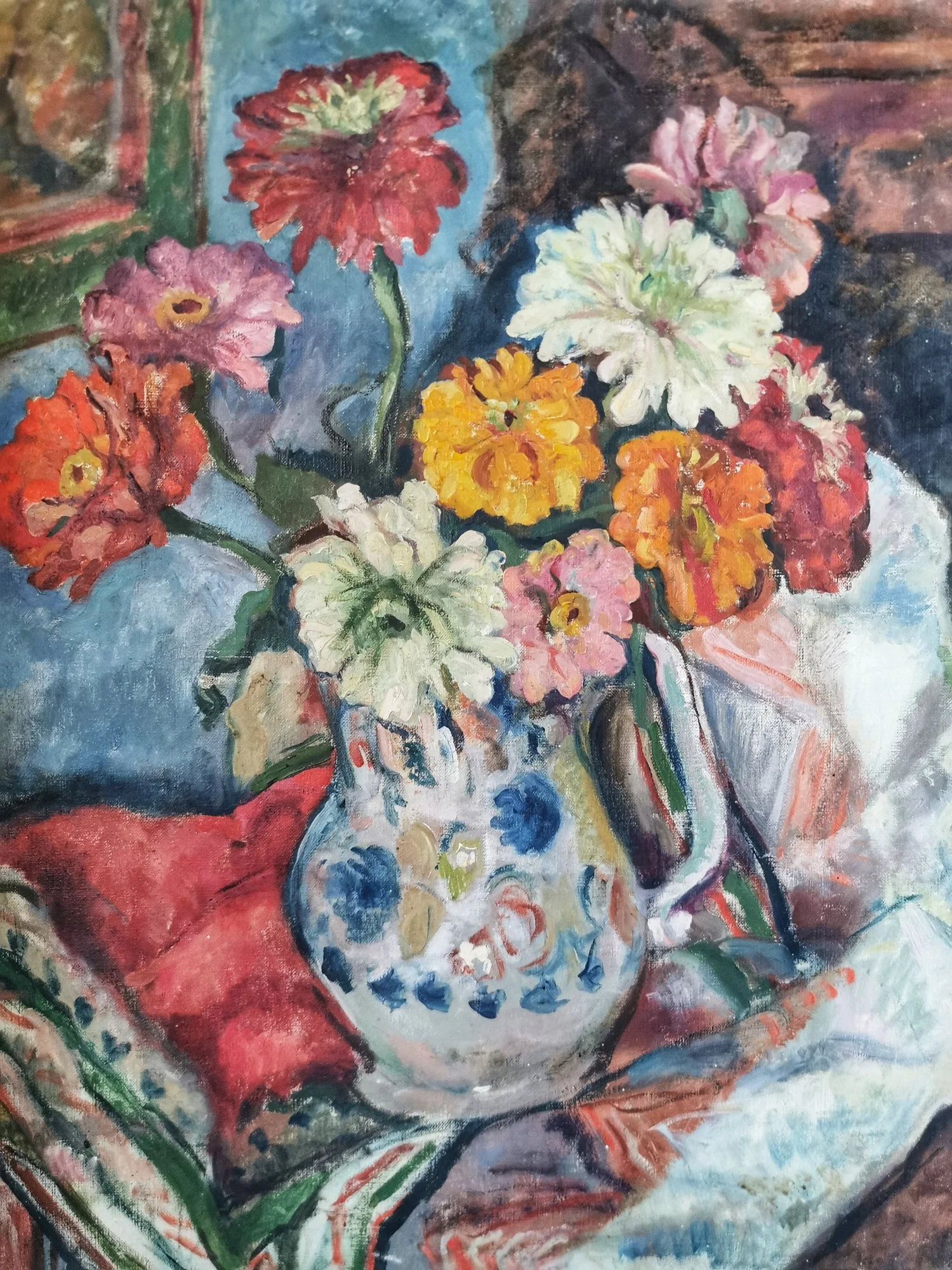A colorful oil painting of a bouquet of flowers in a patterned vase on a table with a red cloth. The flowers are in shades of red, pink, white, yellow, and orange, set against a vibrant background.