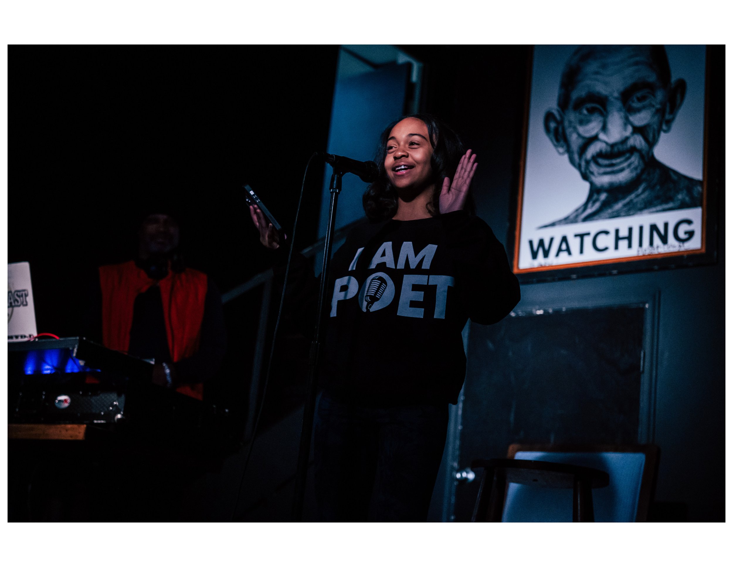   Youth Poet Lemonade Dream performs an original poem at an open mic event hosted by Words Beats &amp; Life Inc. at Busboys and Poets in Washington, DC. Photographer/Victoria Ford  