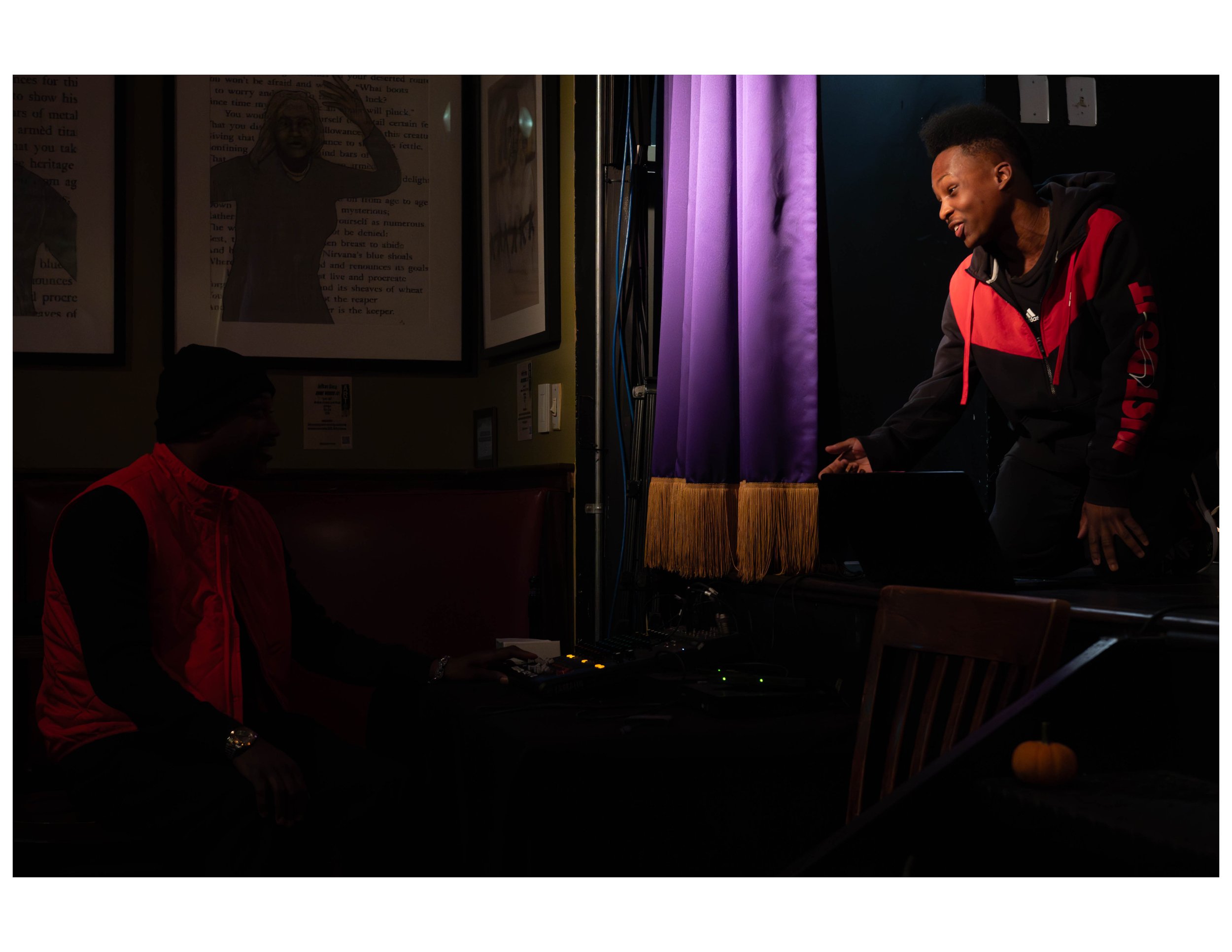   Youth Poet Mica Super performs an original song at an open mic event hosted by Words Beats &amp; Life Inc. at Busboys and Poets in Washington, DC. Photographer/Victoria Ford  