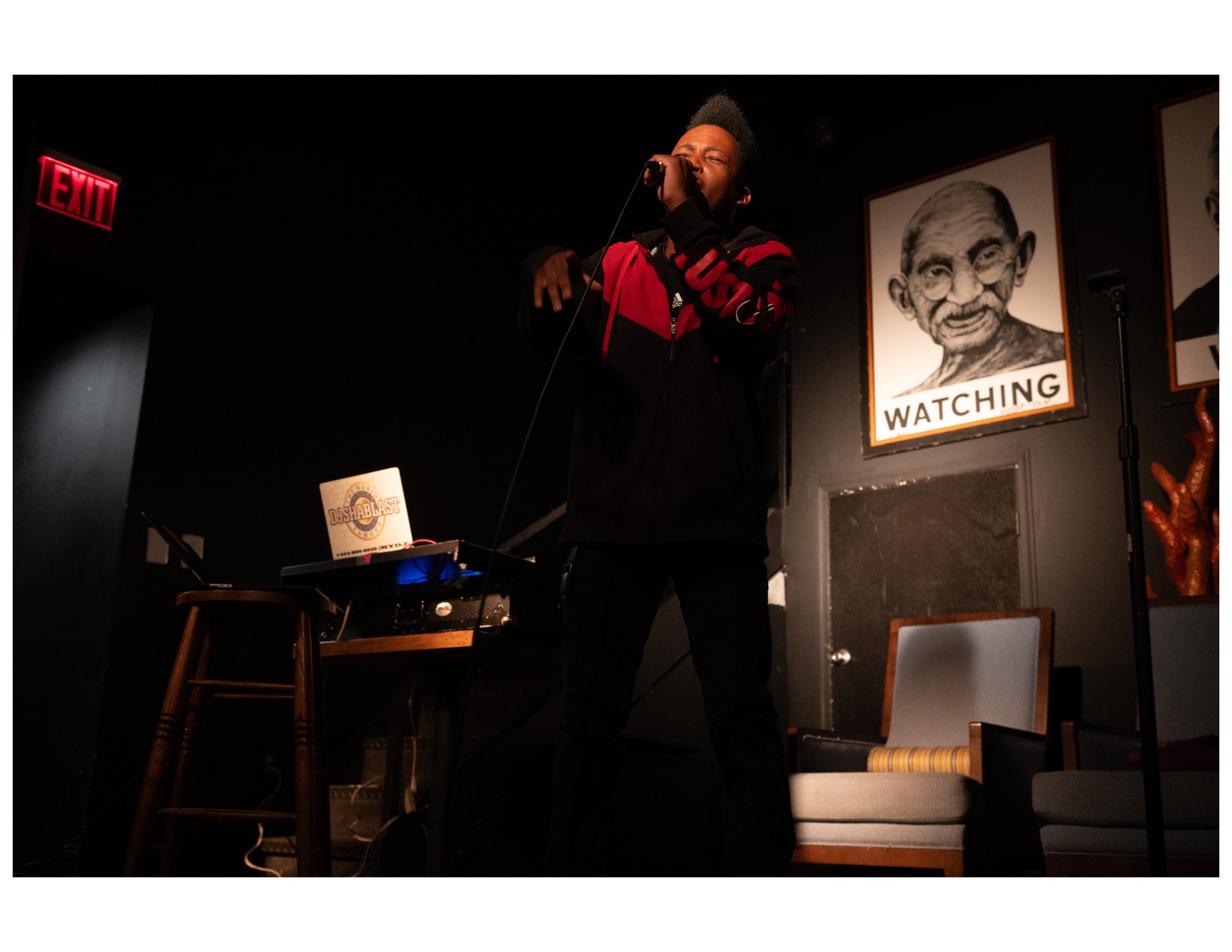   Youth Poet Mica Super performs an original song at an open mic event hosted by Words Beats &amp; Life Inc. at Busboys and Poets in Washington, DC. Photographer/Victoria Ford  