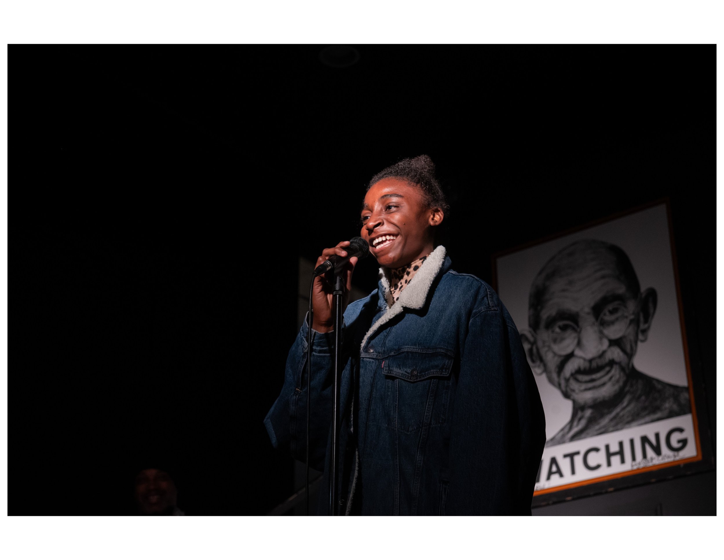   Youth Poet performs original poem at an open mic event hosted by Words Beats &amp; Life Inc. at Busboys and Poets in Washington, DC. Photographer/Victoria Ford  