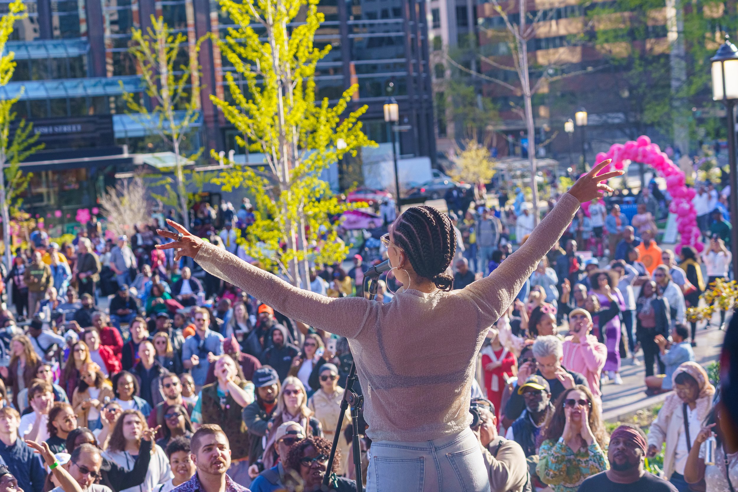  Madison McFerrin performing onstage at Jazz and Blossoms during WBL Fest 2024. Photo/DowntownDC BID. 