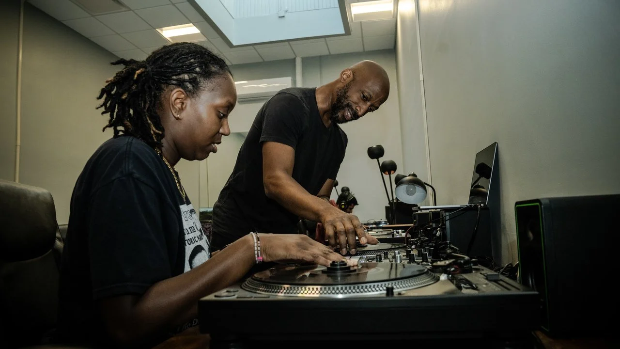 A student gets hands on instruction from Wendel Patrick at the Peabody Hip Hop Summer Intensive