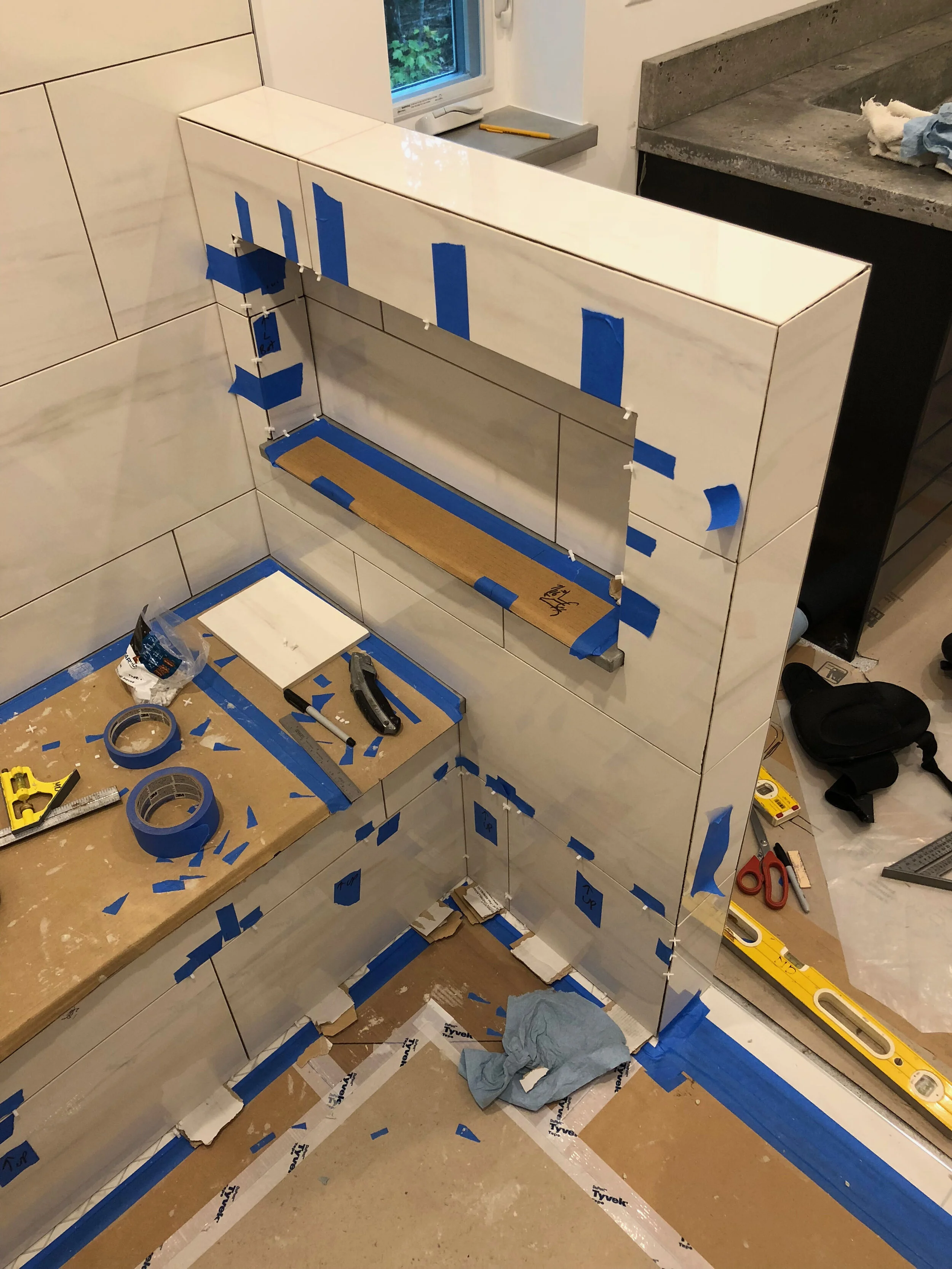 tile installation tile shower 12x24 tile inset shelf bench seat
