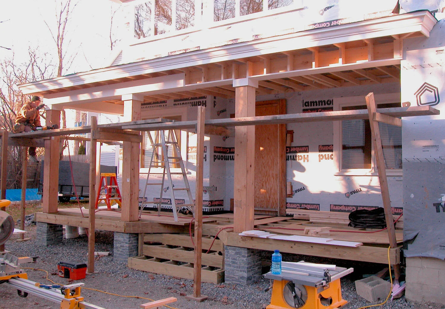 construction of covered porch wood exterior trim granite rock posts