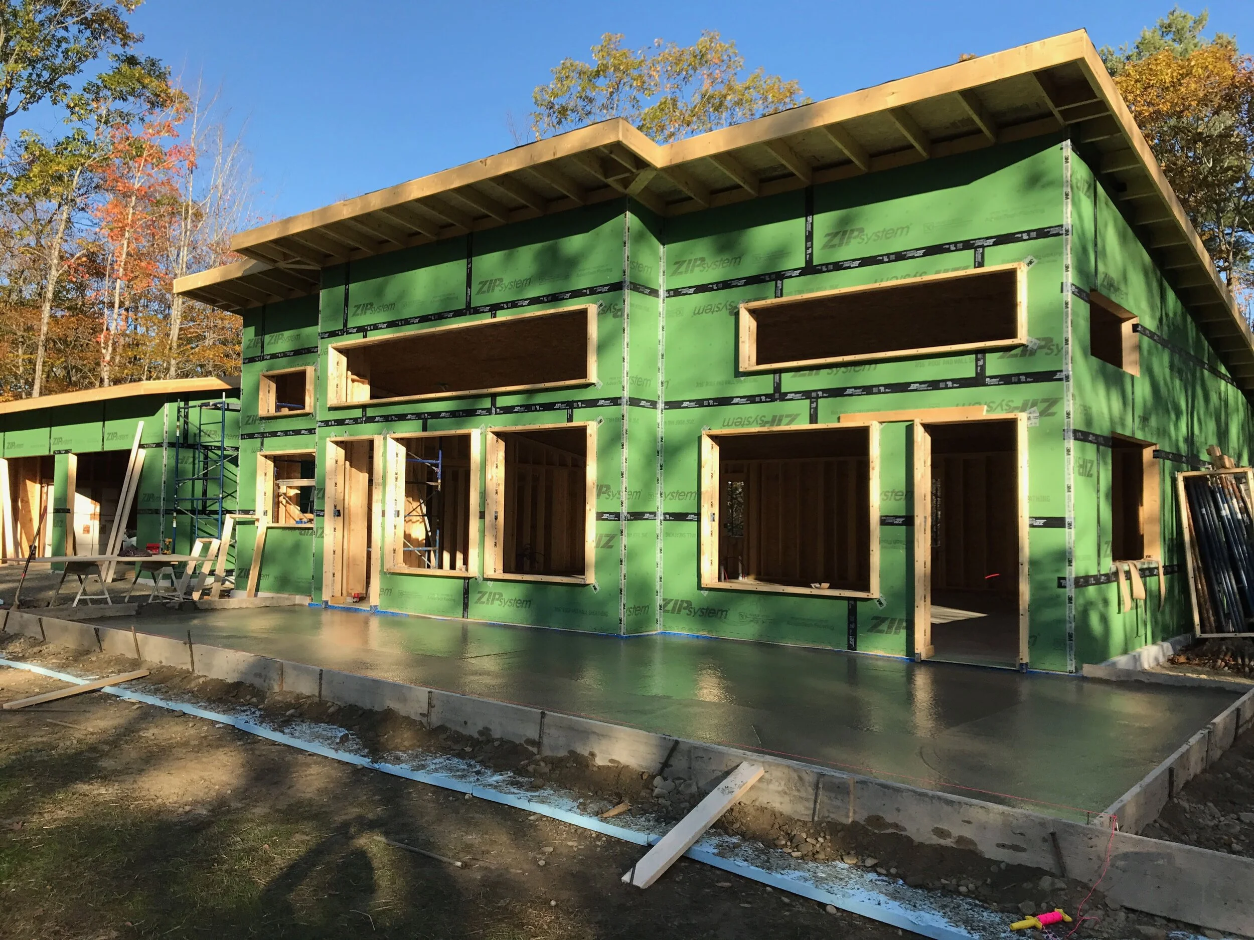 Modern single story home poured concrete patio