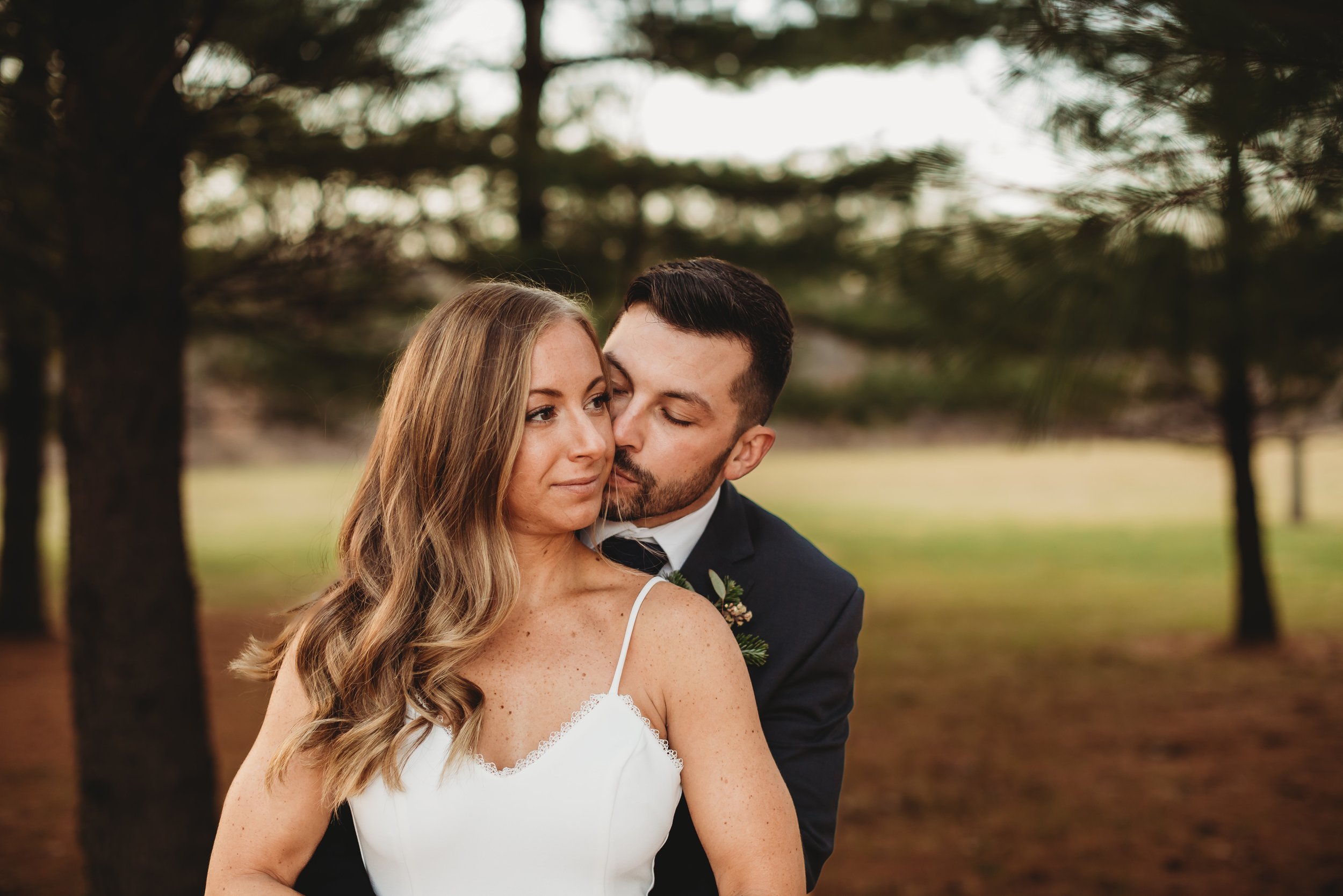  Wedding photographer Teala Ward Photography captures a groom and bride in a forest in LaSalle, IL. winter weddings outdoor bridal pics #tealawardphotography #tealawardweddings #LaSalleIllinois #IronwoodontheVermillion #weddingphotographyIL 