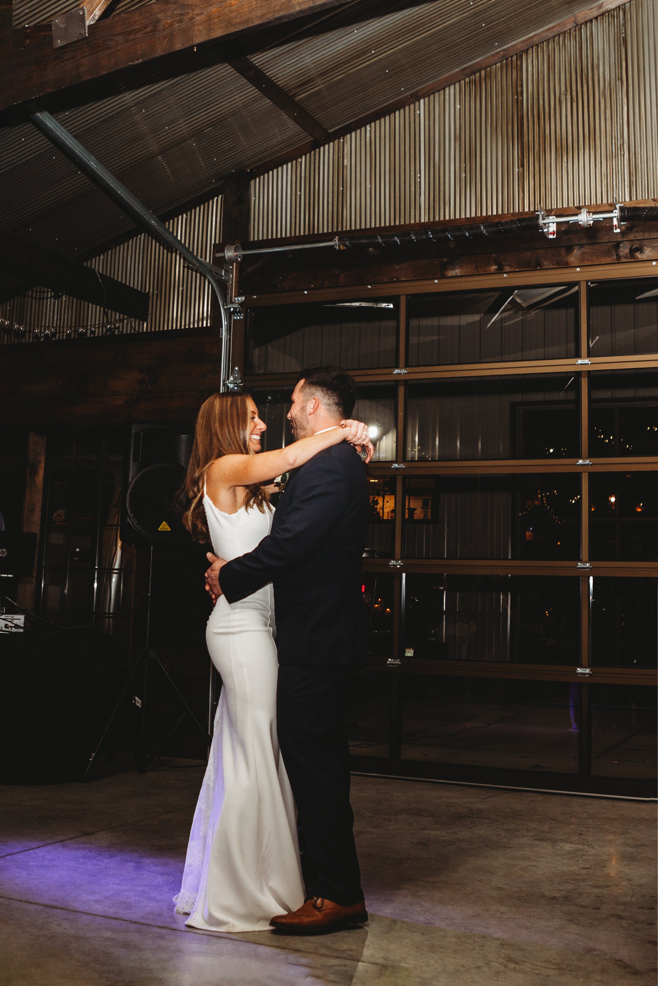  A bride with a big smile on her face shares the first dance with her husband on their wedding day by Teala Ward Photography. first dance bride #tealawardphotography #tealawardweddings #LaSalleIllinois #IronwoodontheVermillion #weddingphotographyIL 