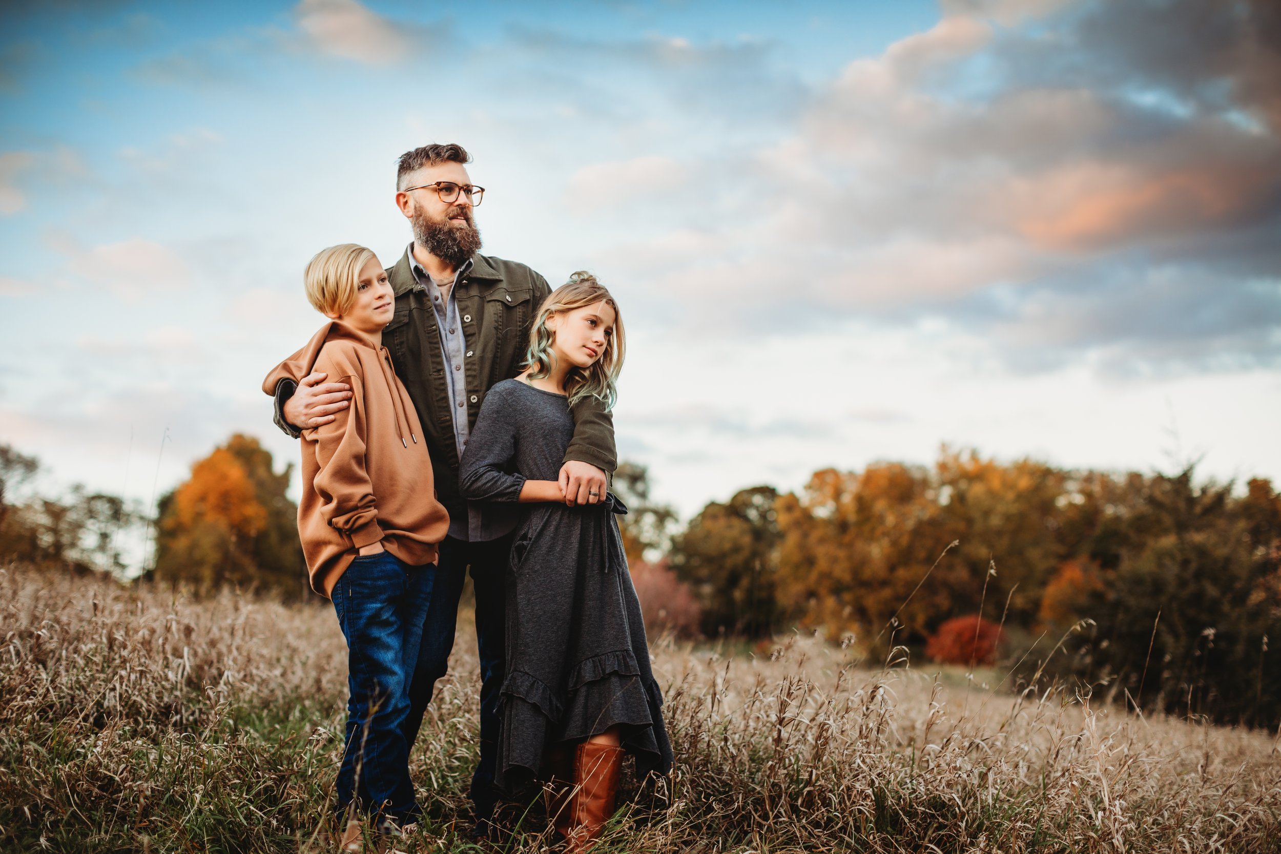  Teala Ward Photography captures a father hugging his daughter and son at a nature park. natural family photos unposed portraits #tealawardphotography #tealawardfamilies #springvalleyillinois #springvalleyphotographers #Illinoisfamilyphotographer 