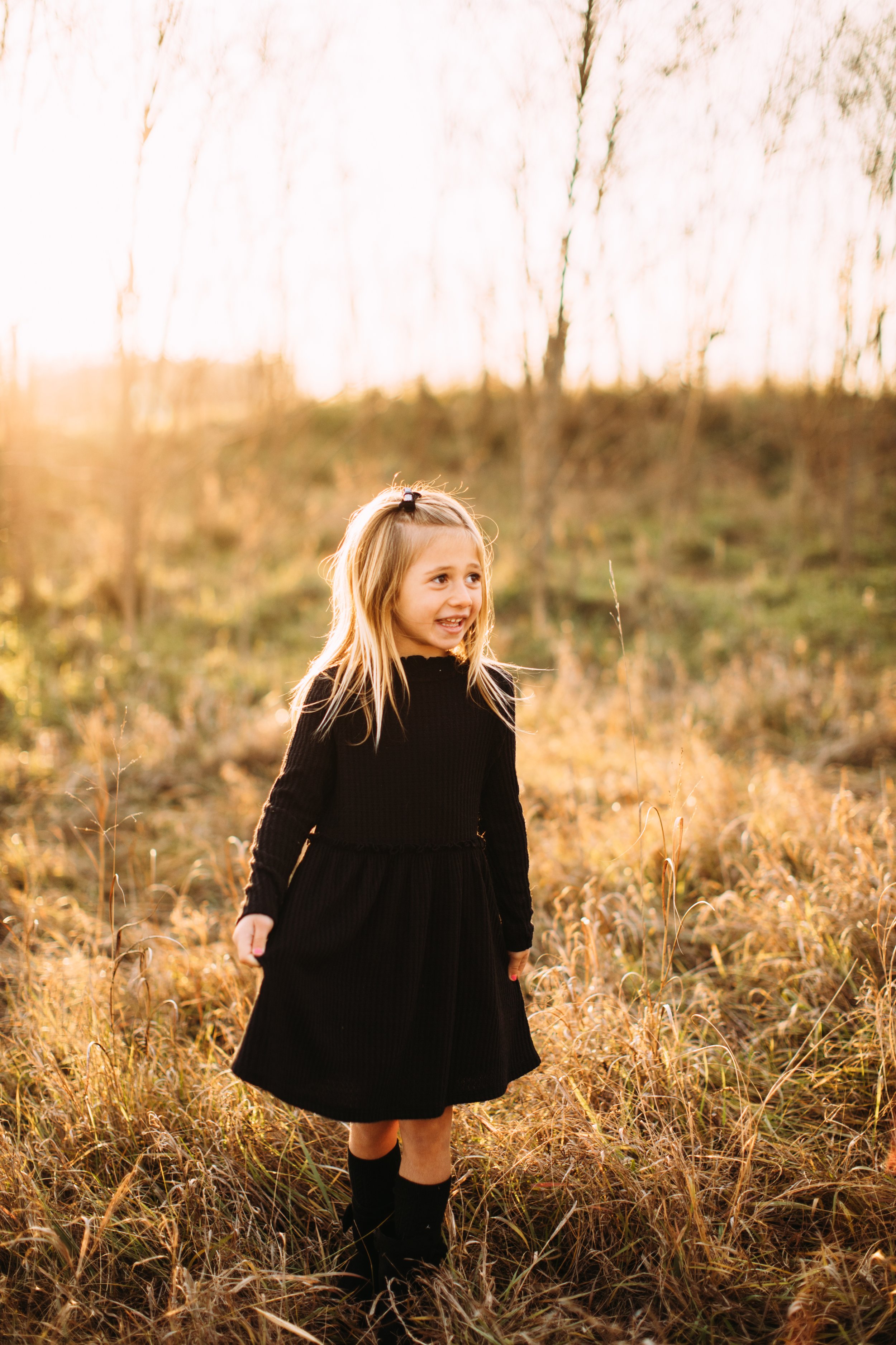  Little girl wearing a black dress for family pictures during the fall in Utica, Illinois by Teala Ward Photography. dress fall outfit #TealaWardPhotography #TealaWardFamilies #StarvedRockStatePark #BuffaloRockPhotographers #UticaIllinoisphotographer