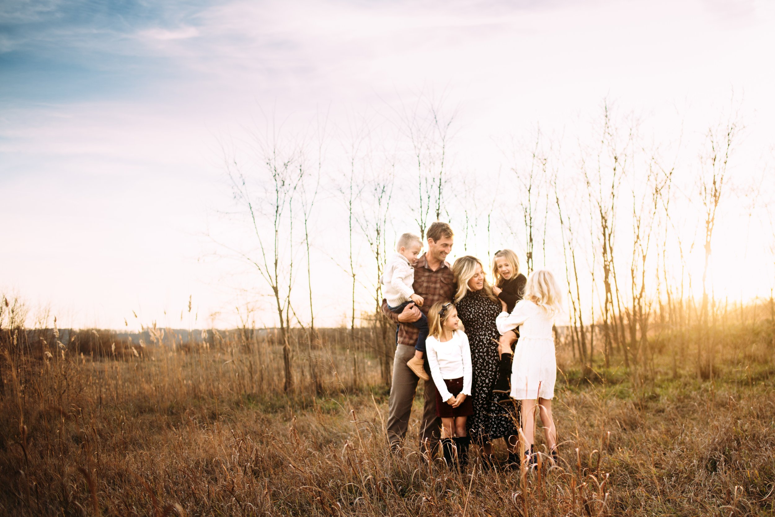  A family portrait was taken at Starved Rock State Park with blue skies behind them by Teala Ward Photography. photographers Utica area #TealaWardPhotography #TealaWardFamilies #StarvedRockStatePark #BuffaloRockPhotographer #UticaIllinoisphotographer