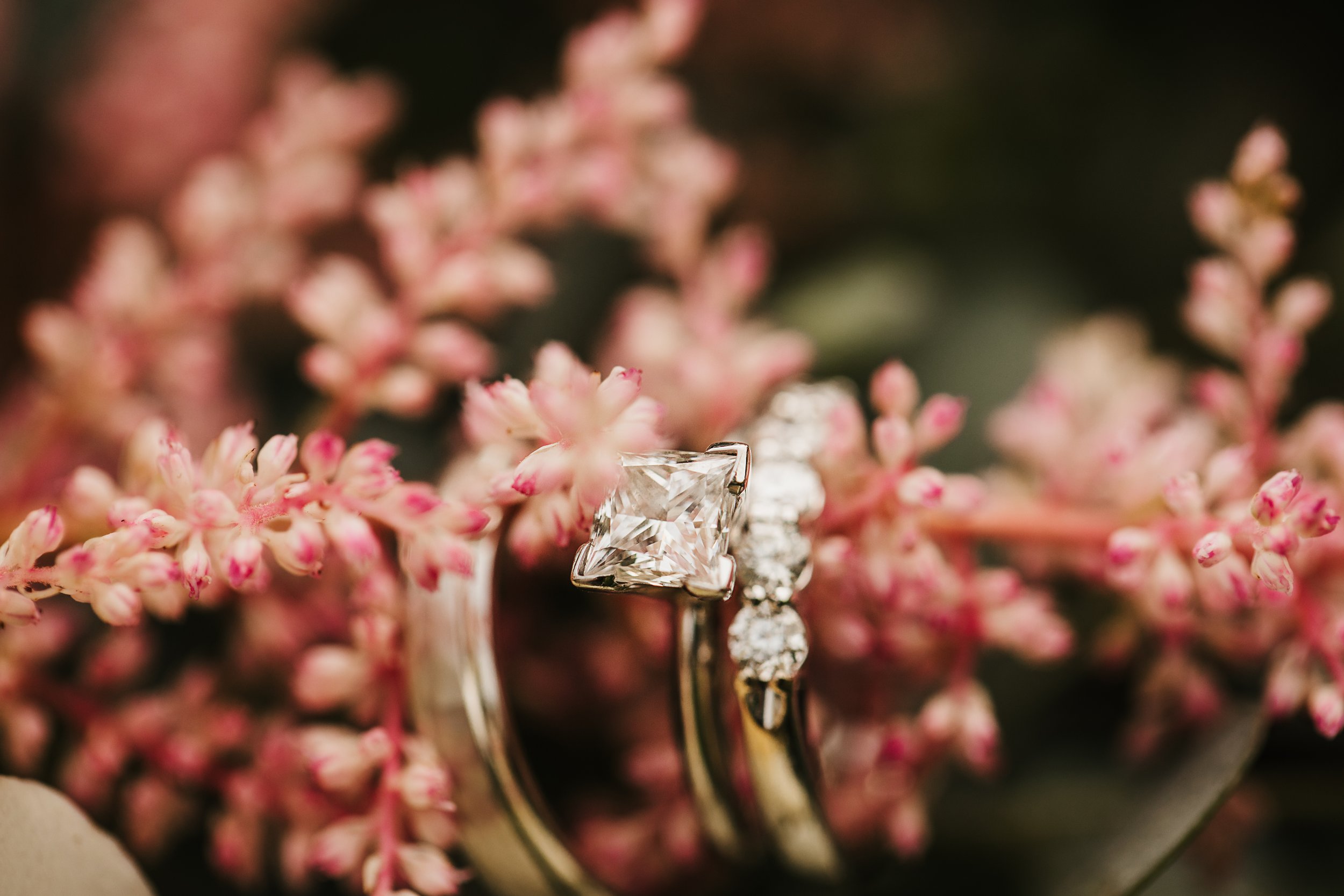  Closeup of a gorgeous solitaire gold wedding ring with diamond band. gold band his and hers wedding rings pink flowers intimate wedding #TealaWardPhotography #illinoisphotographer #princetonillinois #weddingphotographer #intimatewedding 